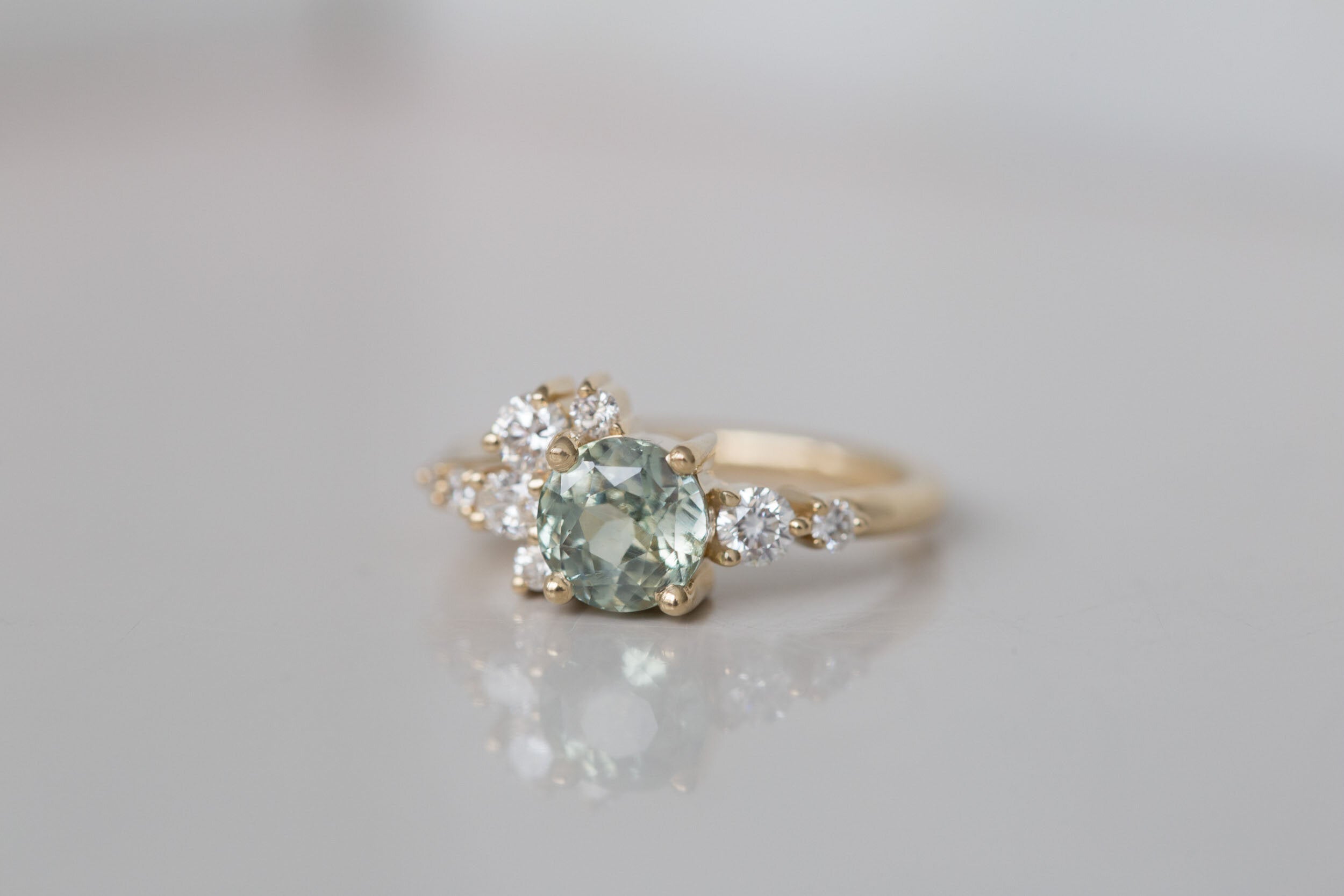 Ilia Ring | Mint Green Round Sapphire 2.07 ct + Diamond Cluster Engagement Ring | 14k Recycled Gold | One of a Kind