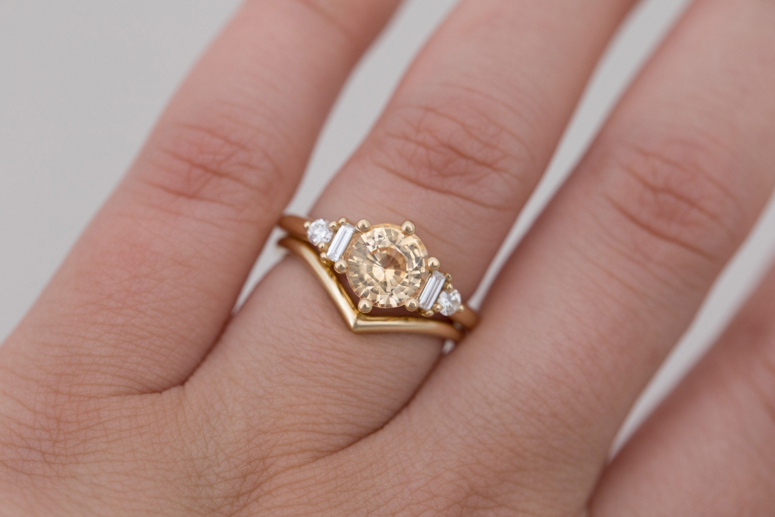 Alsea Ring | Apricot Sapphire + Baguette and Round Diamond Accent Engagement Ring 2.09 ct | 14k Recycled Gold | One of a Kind