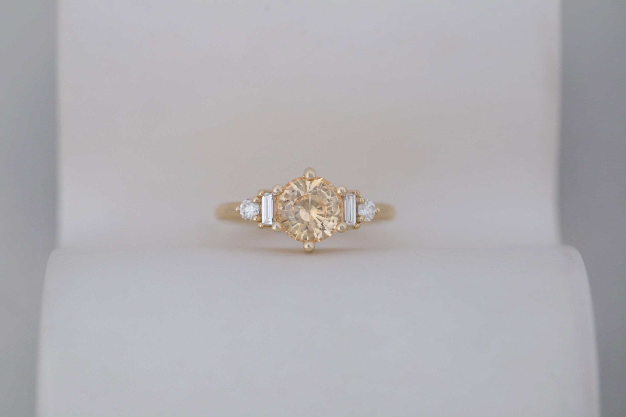 Alsea Ring | Apricot Sapphire + Baguette and Round Diamond Accent Engagement Ring 2.09 ct | 14k Recycled Gold | One of a Kind