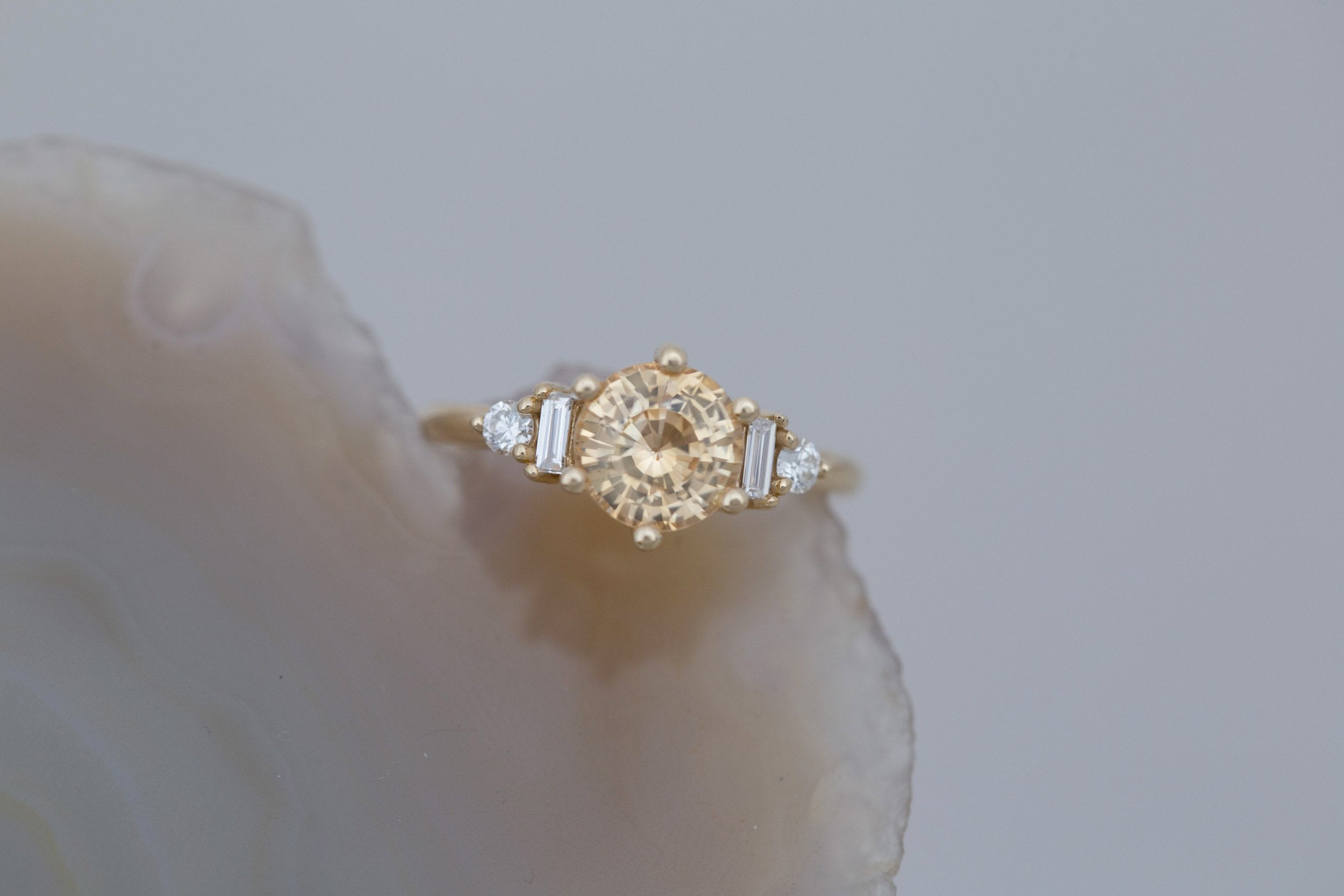 Alsea Ring | Apricot Sapphire + Baguette and Round Diamond Accent Engagement Ring 2.09 ct | 14k Recycled Gold | One of a Kind