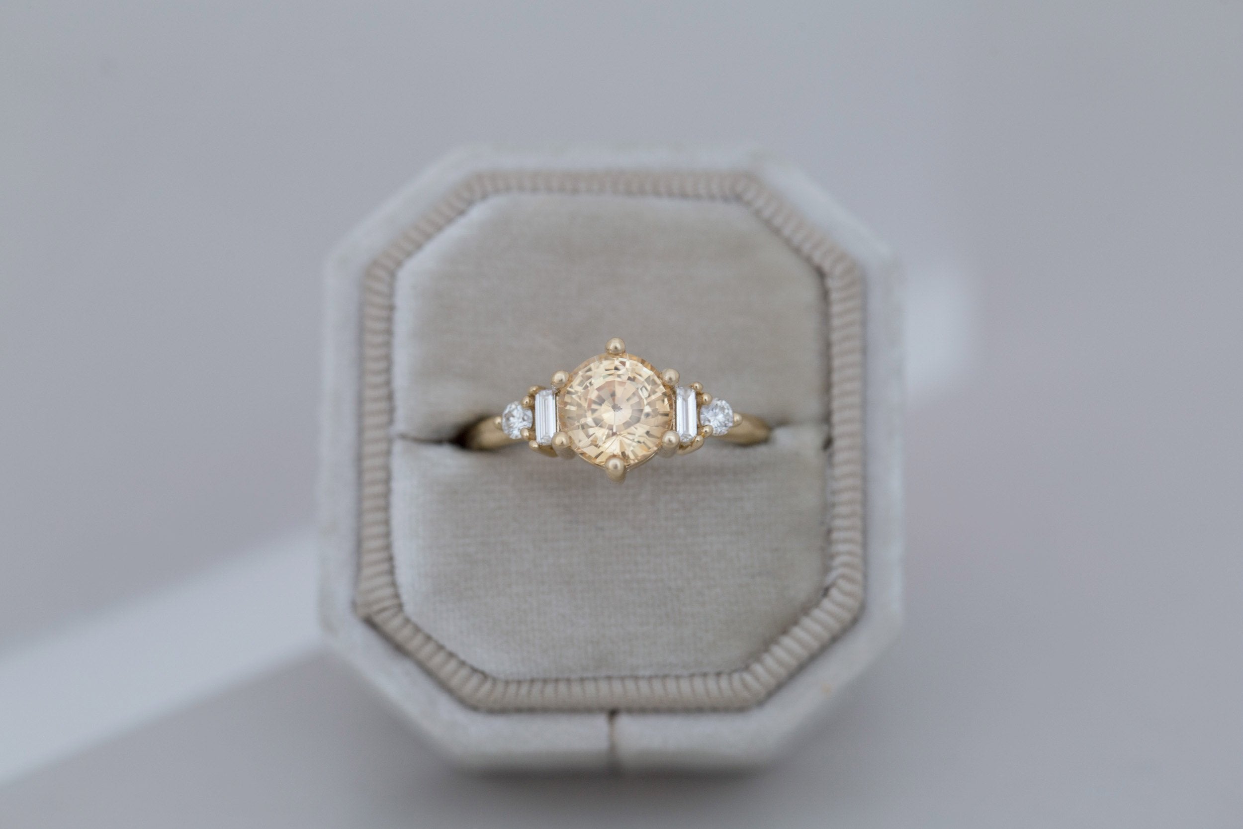 Alsea Ring | Apricot Sapphire + Baguette and Round Diamond Accent Engagement Ring 2.09 ct | 14k Recycled Gold | One of a Kind