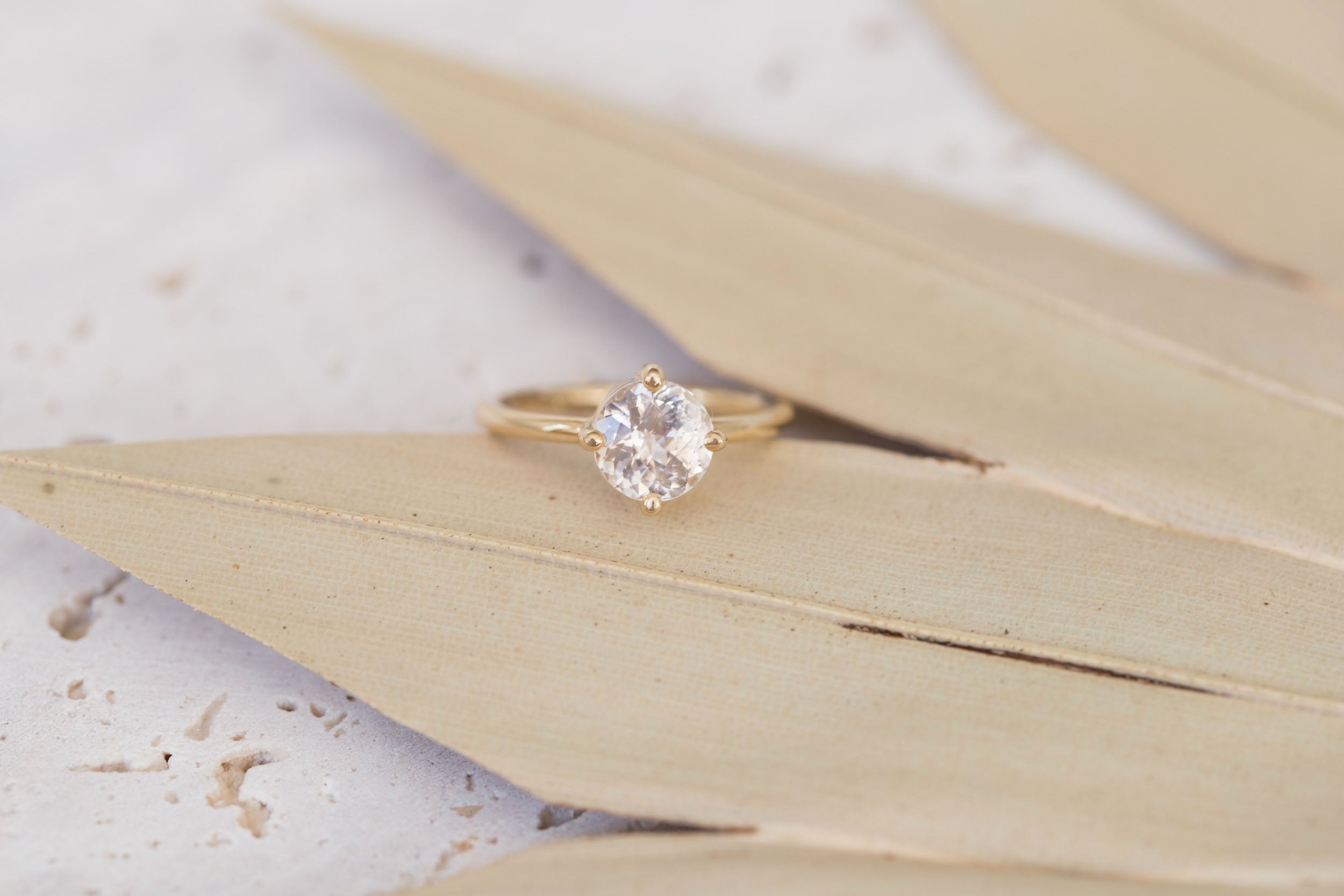 Leta Ring | Icy Blush Round Sapphire Compass Set Solitaire Engagement Ring 2.28 ct | 14k Recycled Gold | One of a Kind