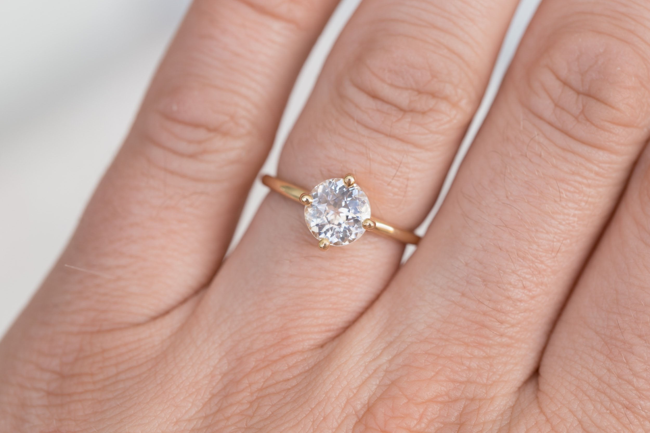 Leta Ring | Icy Blush Round Sapphire Compass Set Solitaire Engagement Ring 2.28 ct | 14k Recycled Gold | One of a Kind