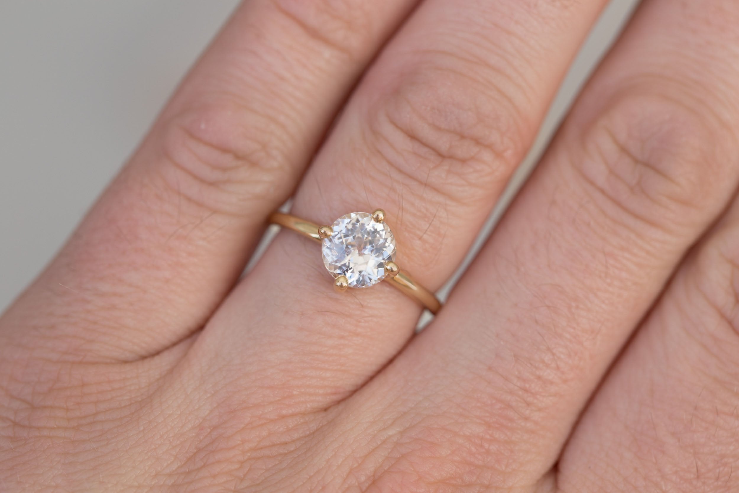 Leta Ring | Icy Blush Round Sapphire Compass Set Solitaire Engagement Ring 2.28 ct | 14k Recycled Gold | One of a Kind