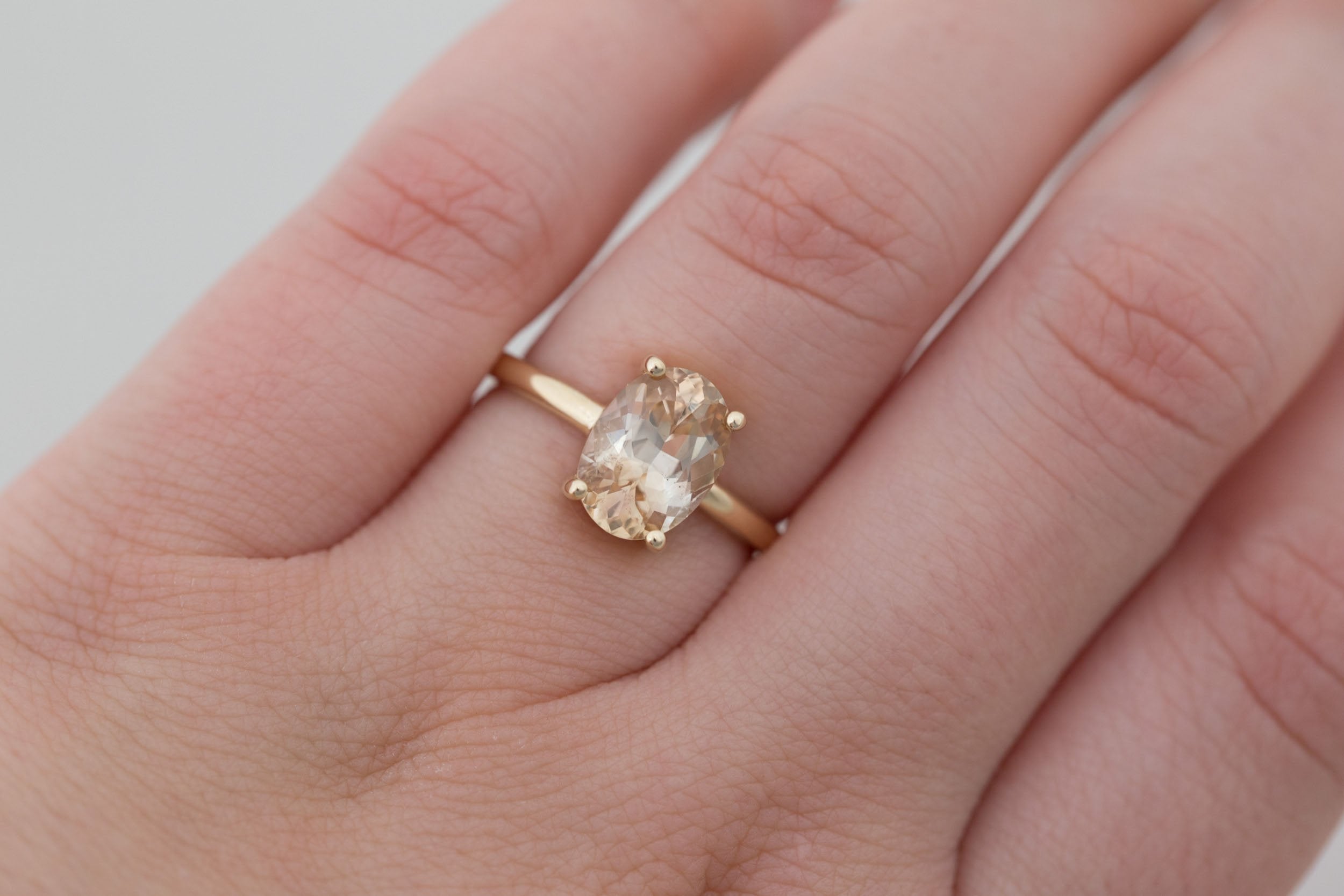 Briar Ring | Apricot Oval Bicolor Sapphire Solitaire Engagement Ring 2.46 ct | 14k Recycled Gold | One of a Kind