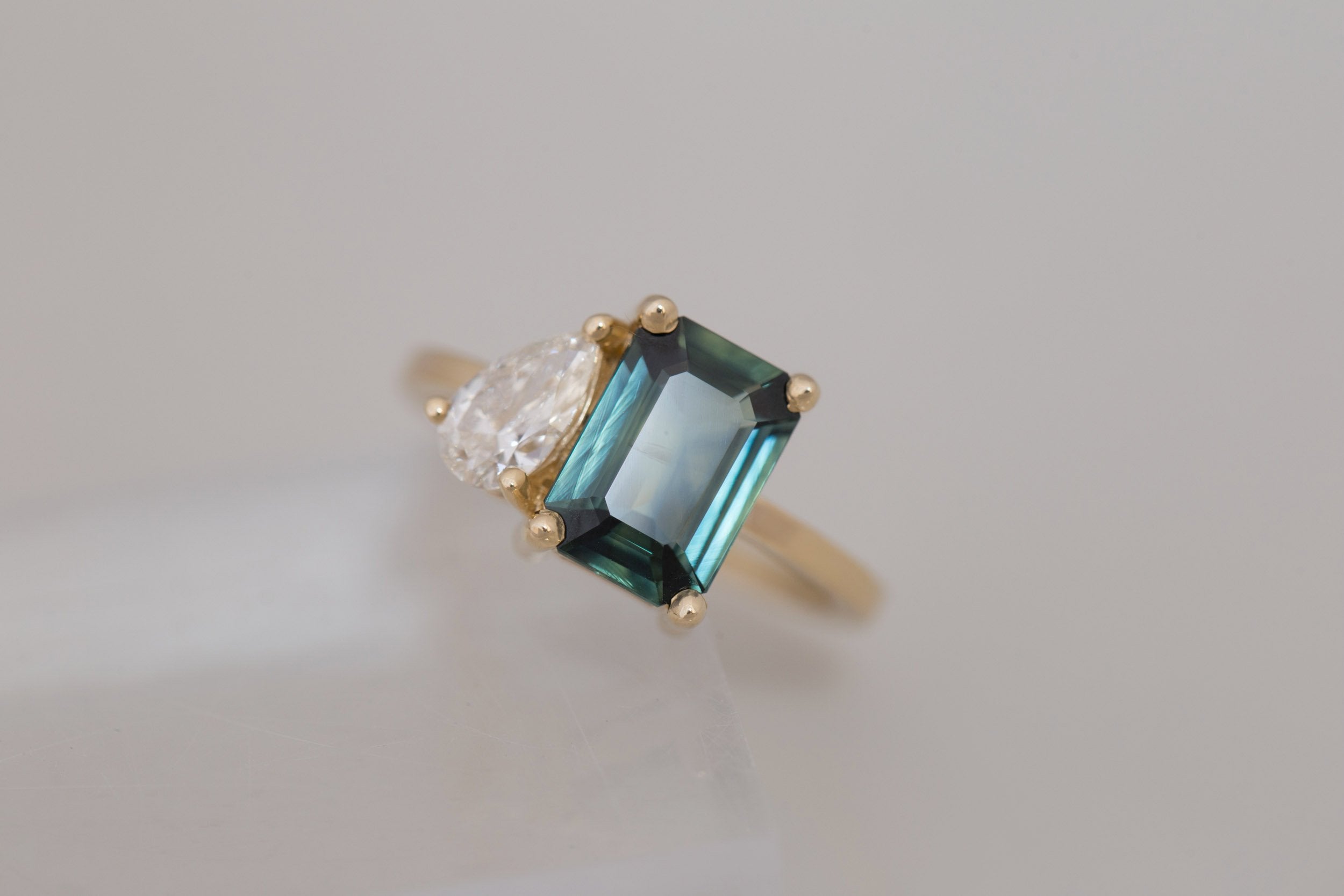 Liana Ring | Teal Emerald Cut Sapphire + Pear Diamond Engagement Ring | 14k Recycled Gold | One of a Kind