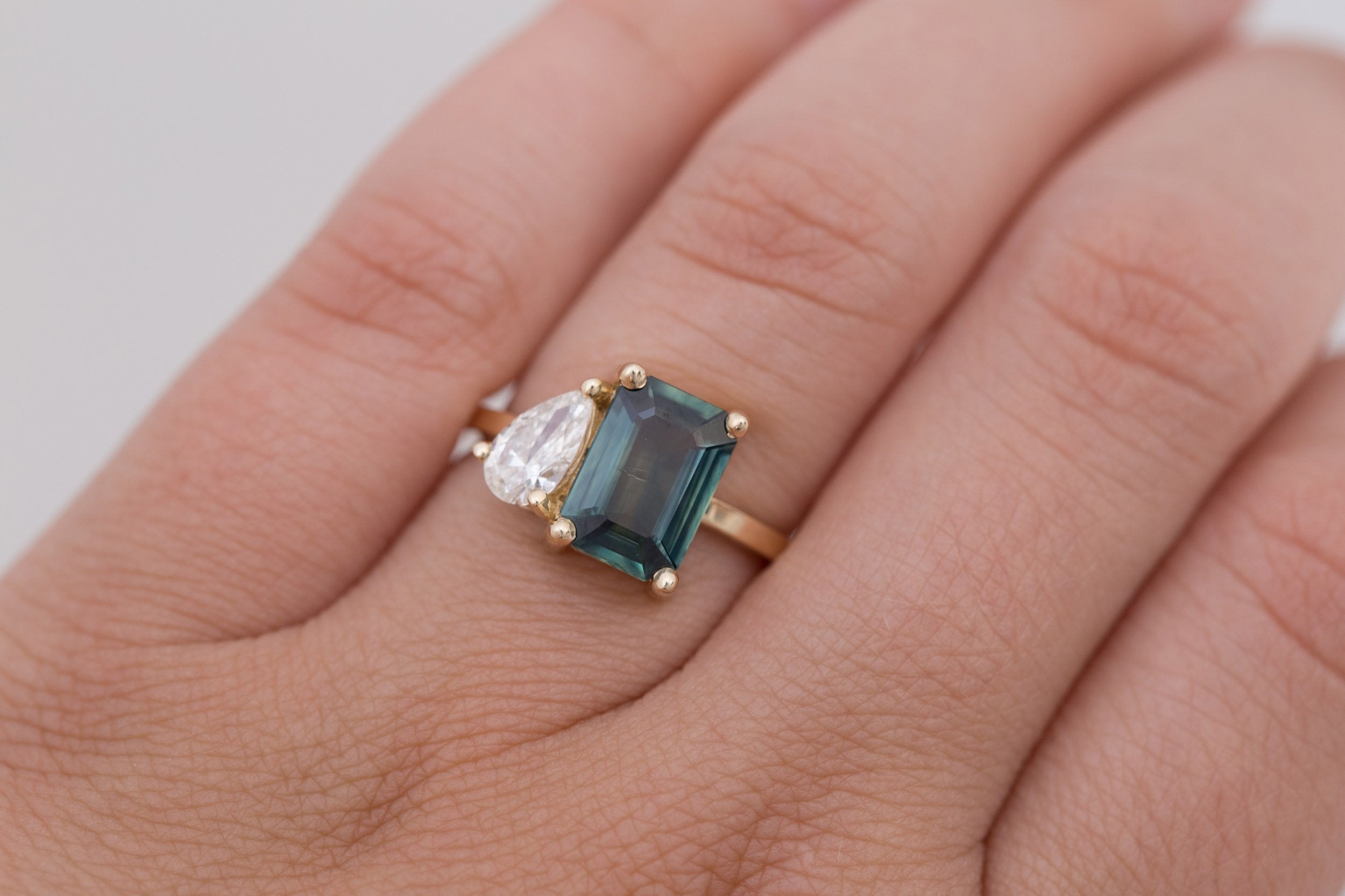 Liana Ring | Teal Emerald Cut Sapphire + Pear Diamond Engagement Ring | 14k Recycled Gold | One of a Kind