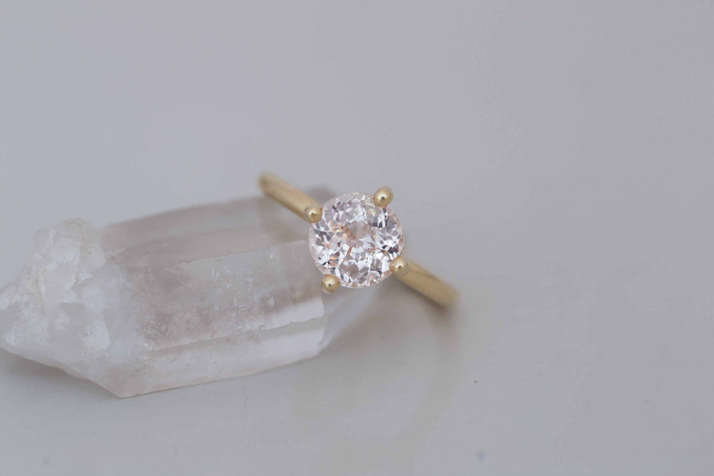 Leta Ring | Icy Blush Round Sapphire Compass Set Solitaire Engagement Ring 2.70 ct | 14k Recycled Gold | One of a Kind