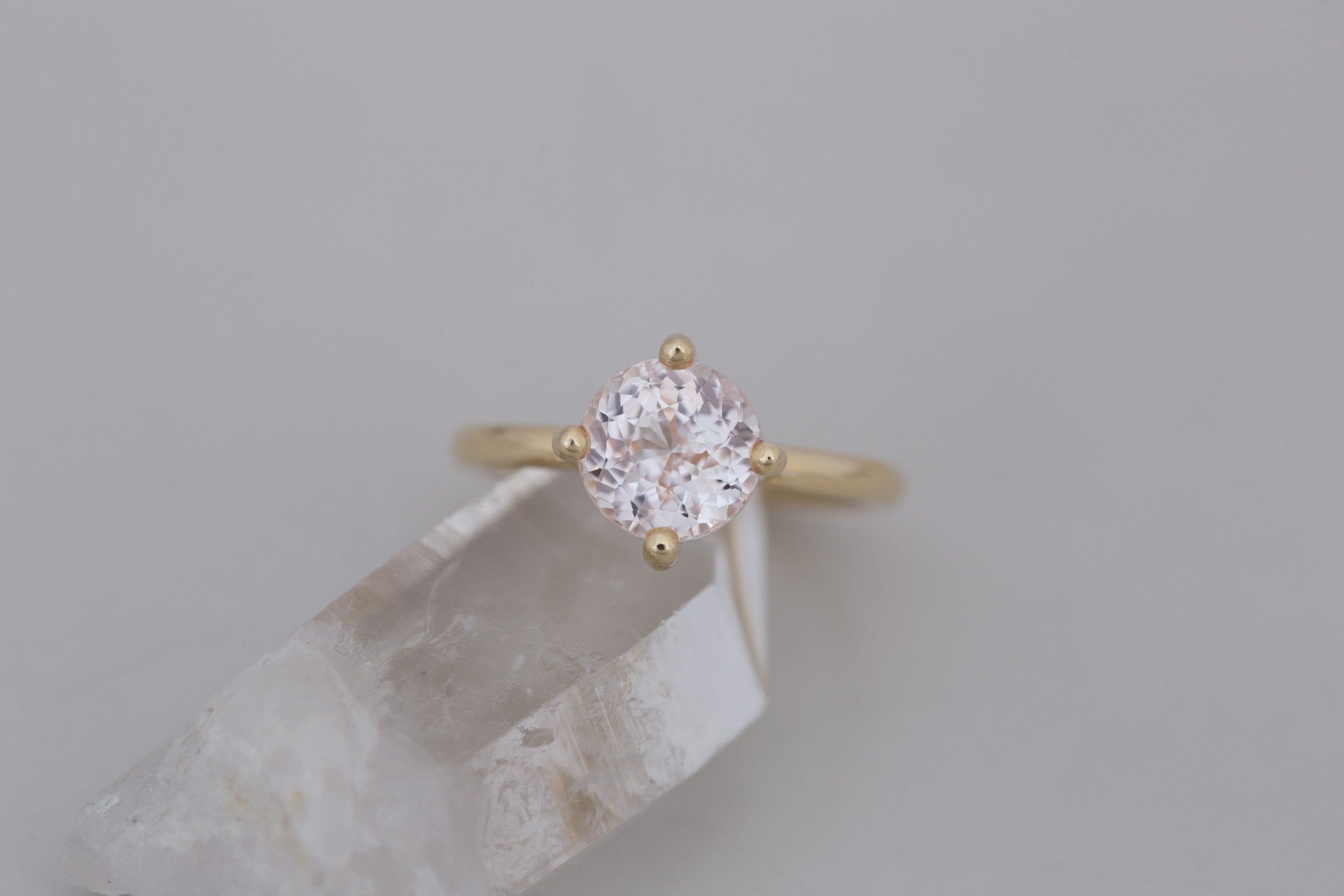 Leta Ring | Icy Blush Round Sapphire Compass Set Solitaire Engagement Ring 2.70 ct | 14k Recycled Gold | One of a Kind