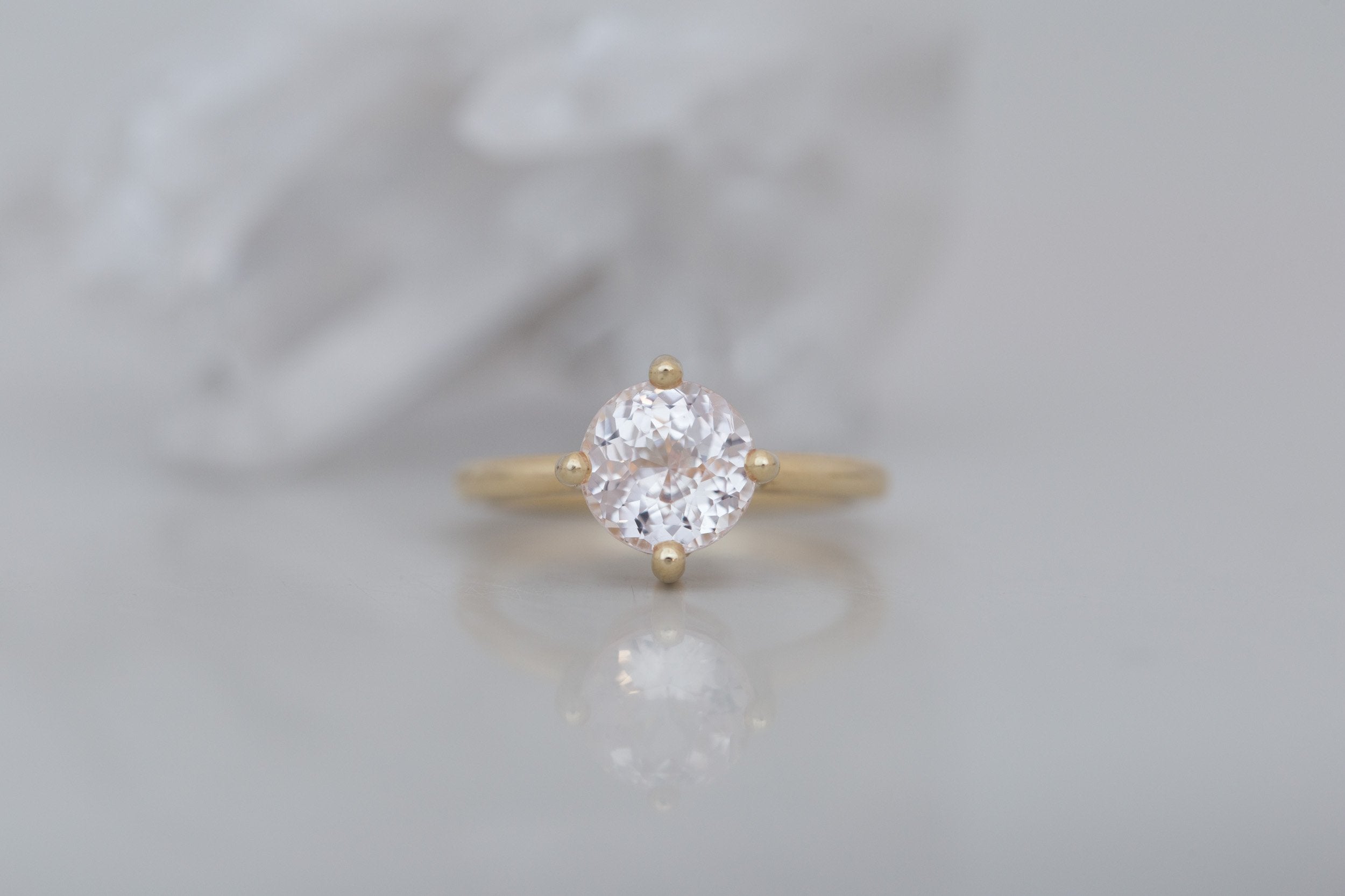 Leta Ring | Icy Blush Round Sapphire Compass Set Solitaire Engagement Ring 2.70 ct | 14k Recycled Gold | One of a Kind