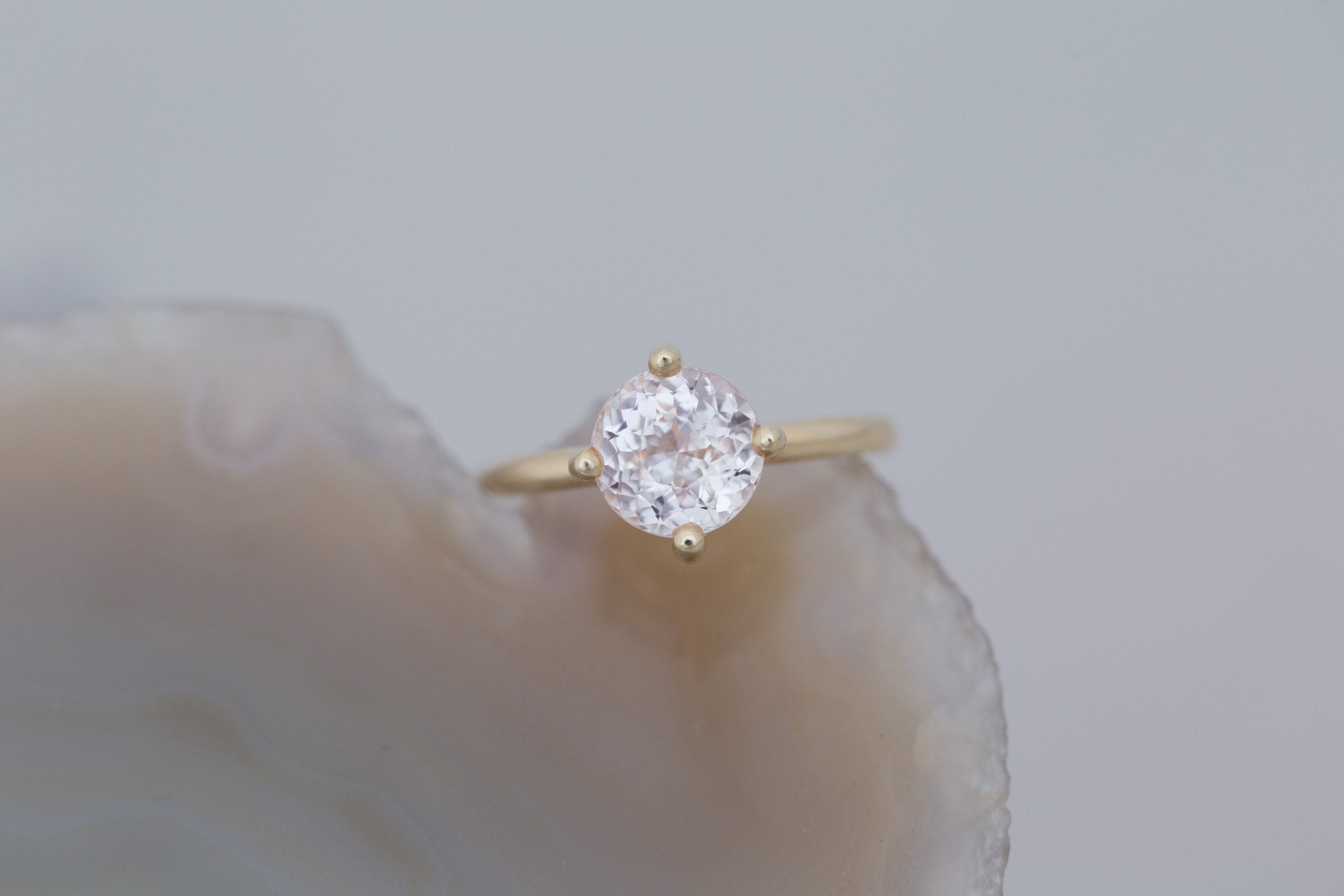 Leta Ring | Icy Blush Round Sapphire Compass Set Solitaire Engagement Ring 2.70 ct | 14k Recycled Gold | One of a Kind