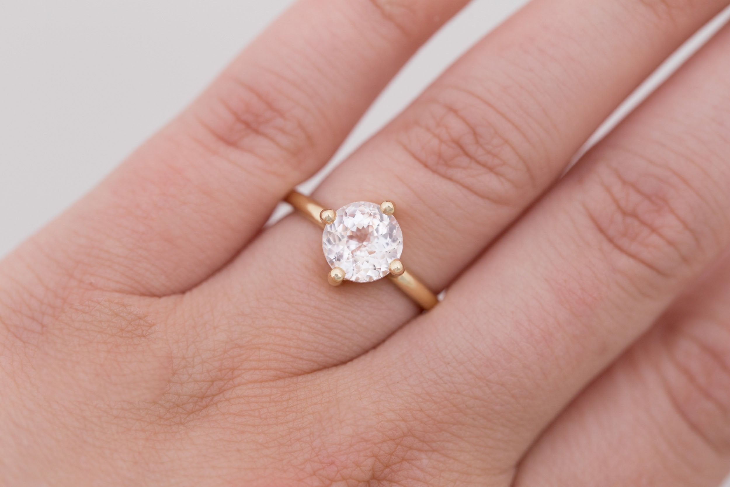 Leta Ring | Icy Blush Round Sapphire Compass Set Solitaire Engagement Ring 2.70 ct | 14k Recycled Gold | One of a Kind