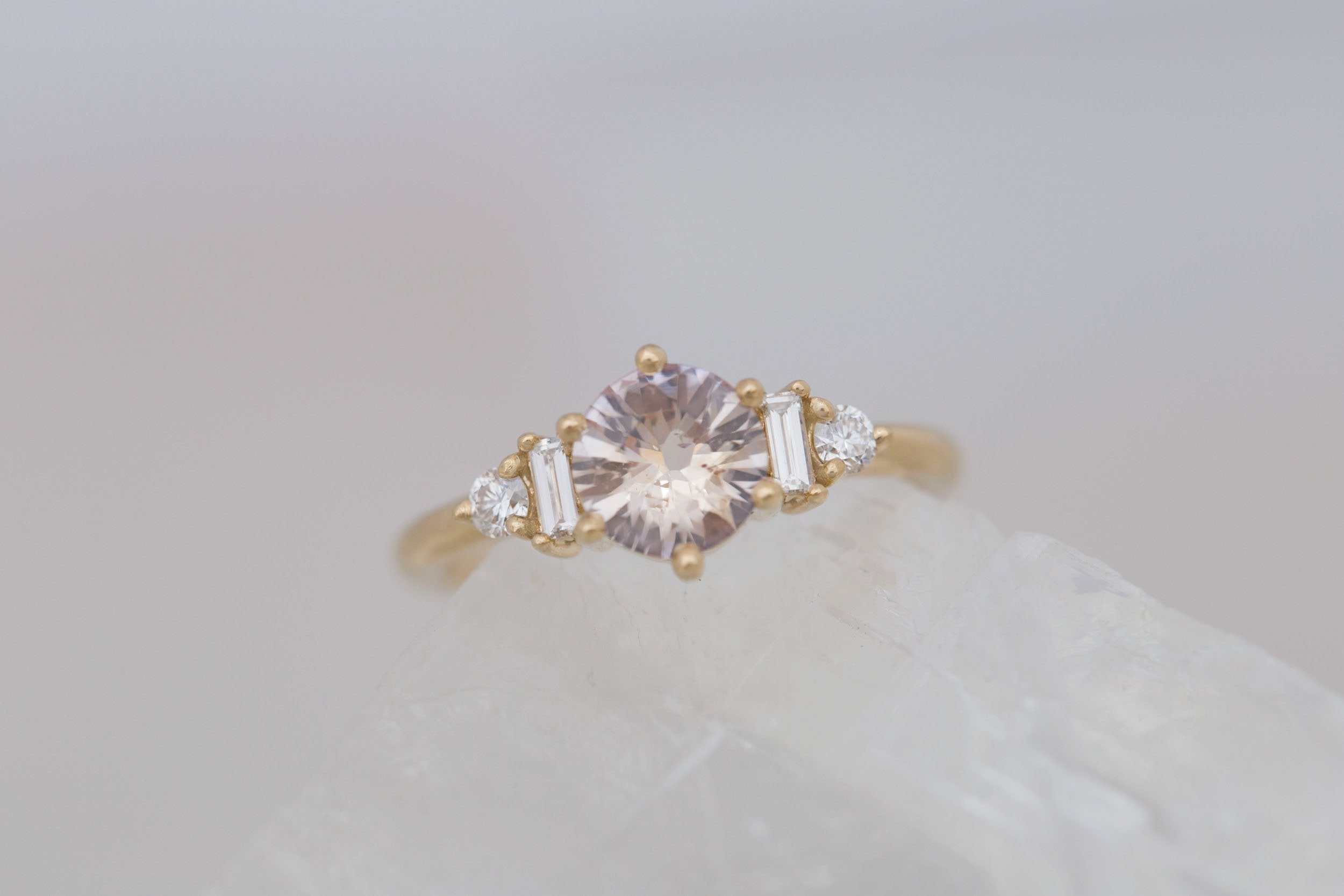 Alsea Ring | Peach Round Sapphire + Baguette and Round Diamond Accent Engagement Ring 1.08 ct | 14k Recycled Yellow Gold | One of a Kind