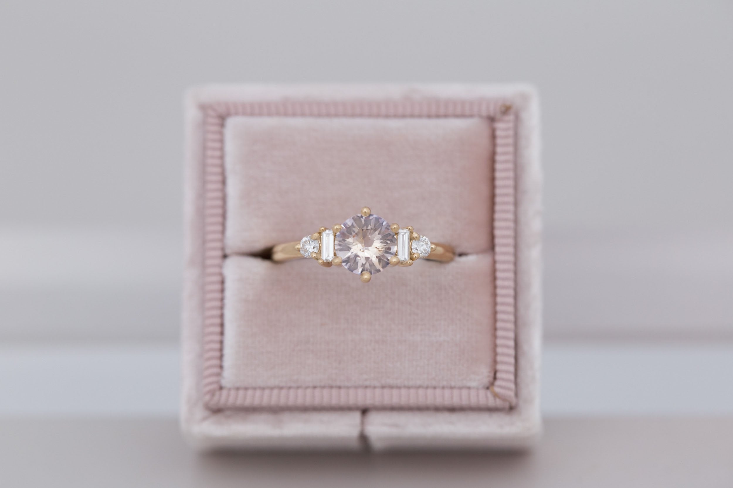 Alsea Ring | Peach Round Sapphire + Baguette and Round Diamond Accent Engagement Ring 1.08 ct | 14k Recycled Yellow Gold | One of a Kind