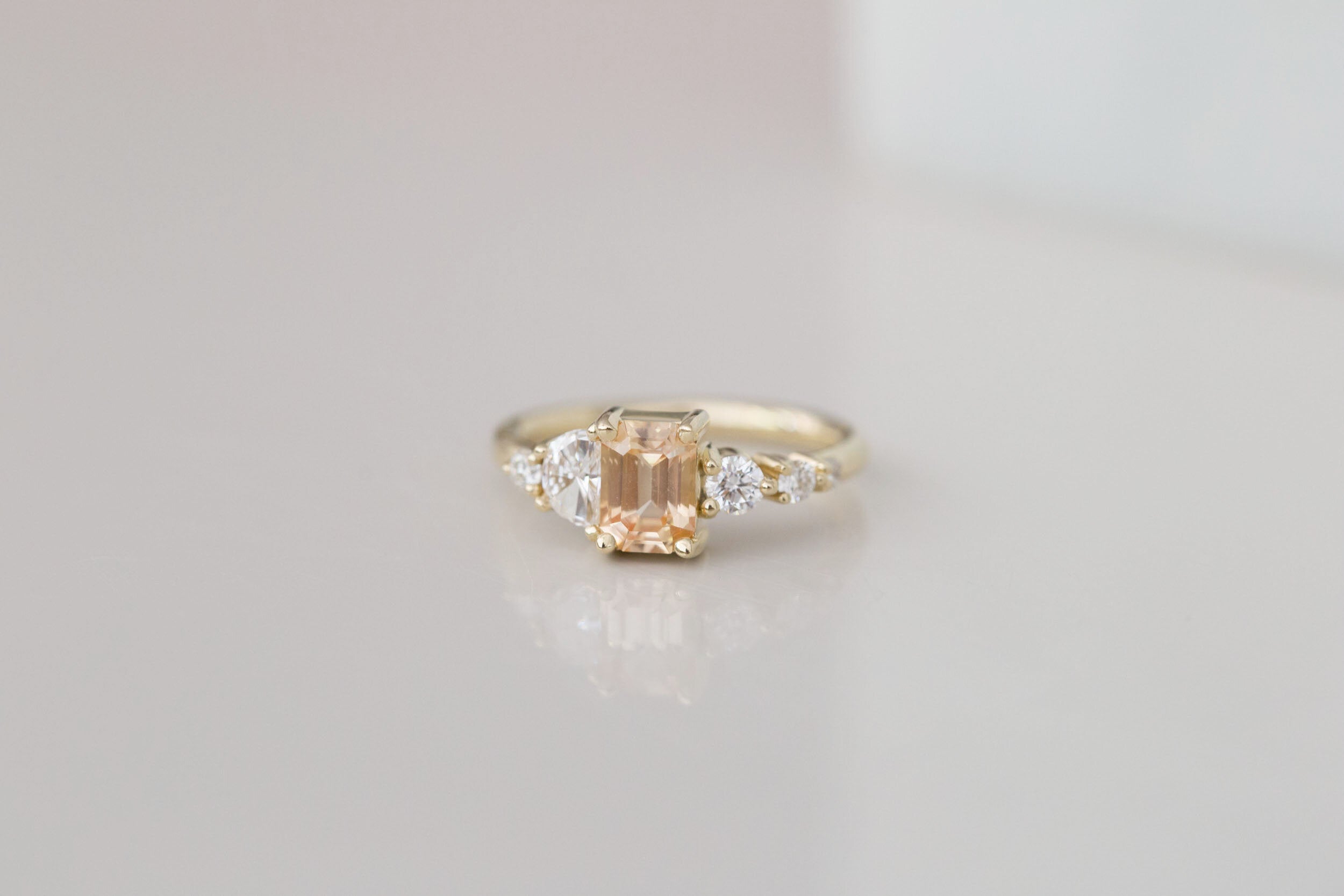 Sarine Ring | Apricot Sapphire + Half Moon Diamond + Diamond Cluster Engagement Ring | 14k Recycled Gold | One of a Kind