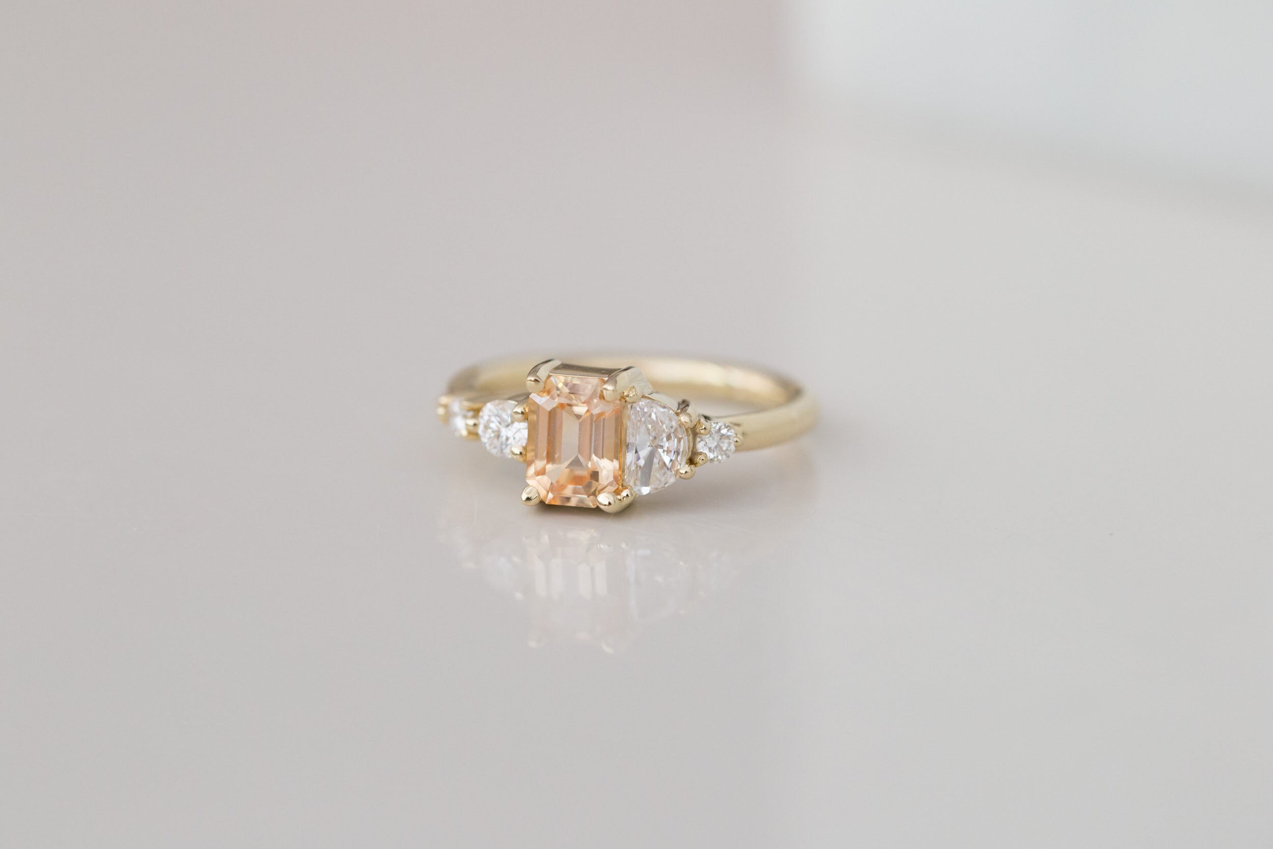 Sarine Ring | Apricot Sapphire + Half Moon Diamond + Diamond Cluster Engagement Ring | 14k Recycled Gold | One of a Kind