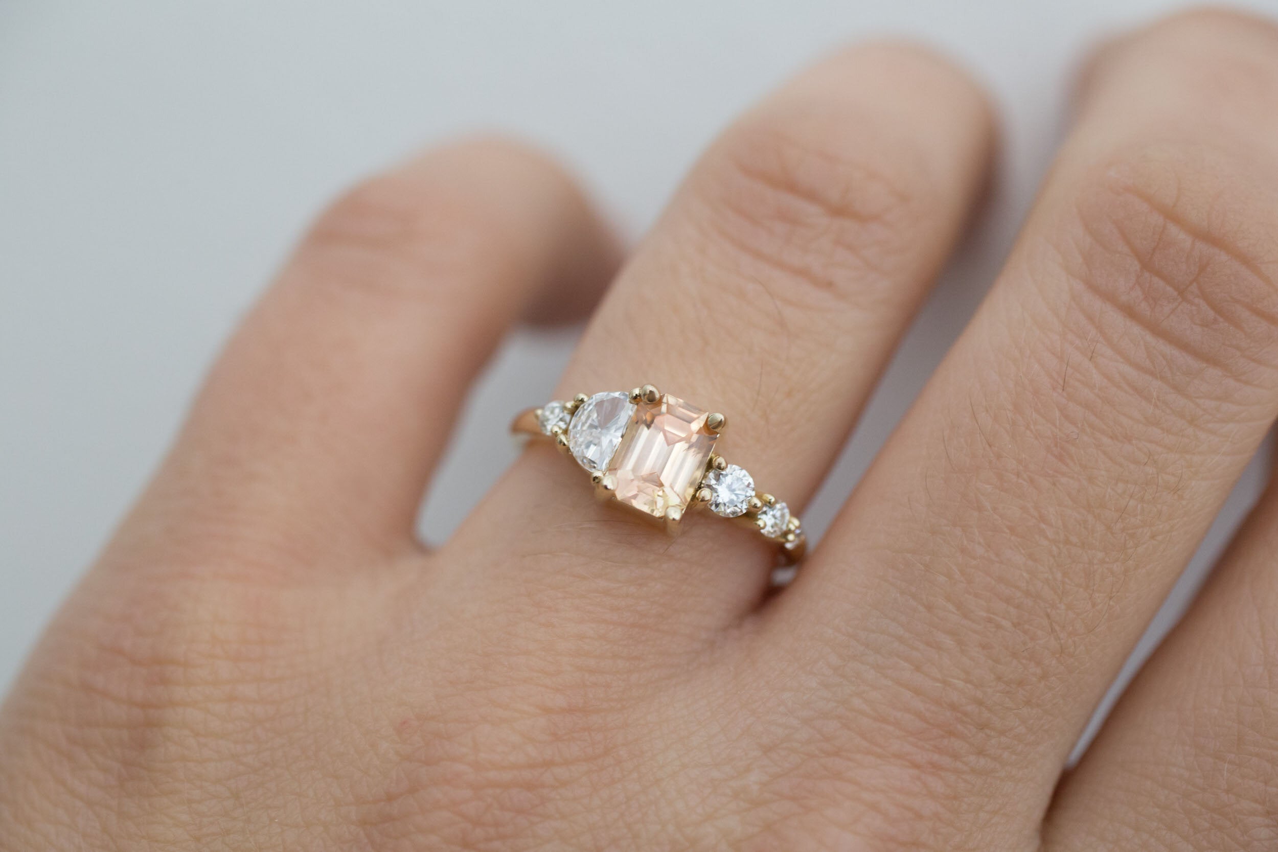 Sarine Ring | Apricot Sapphire + Half Moon Diamond + Diamond Cluster Engagement Ring | 14k Recycled Gold | One of a Kind
