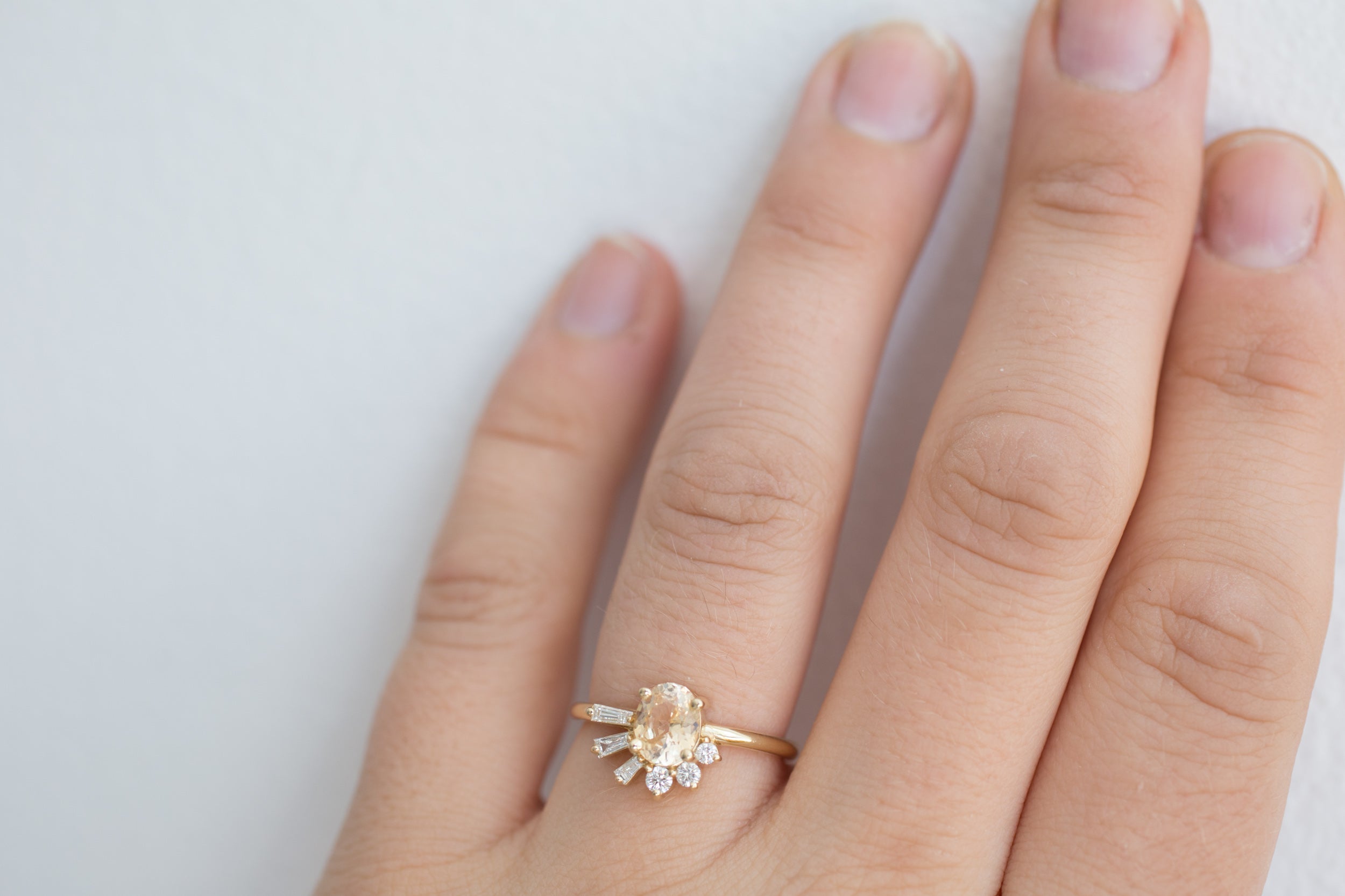 Sol Ring | Apricot Oval Sapphire + Baguette and Round Diamond Cluster Engagement Ring | 14k Recycled Gold | Limited Edition