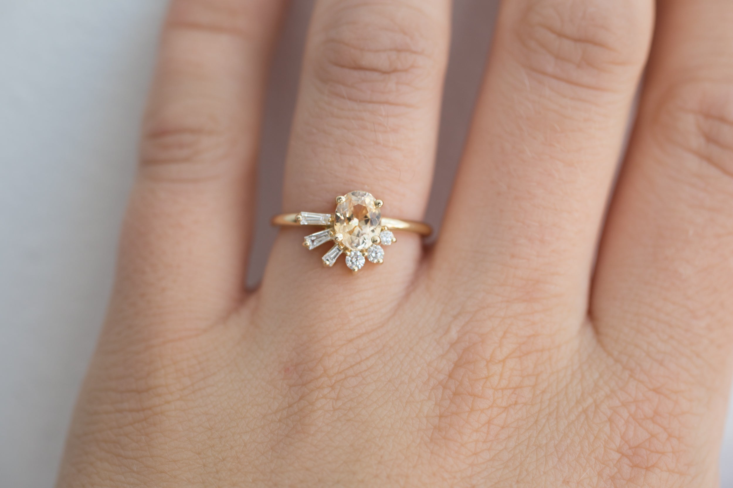 Sol Ring | Apricot Oval Sapphire + Baguette and Round Diamond Cluster Engagement Ring | 14k Recycled Gold | Limited Edition