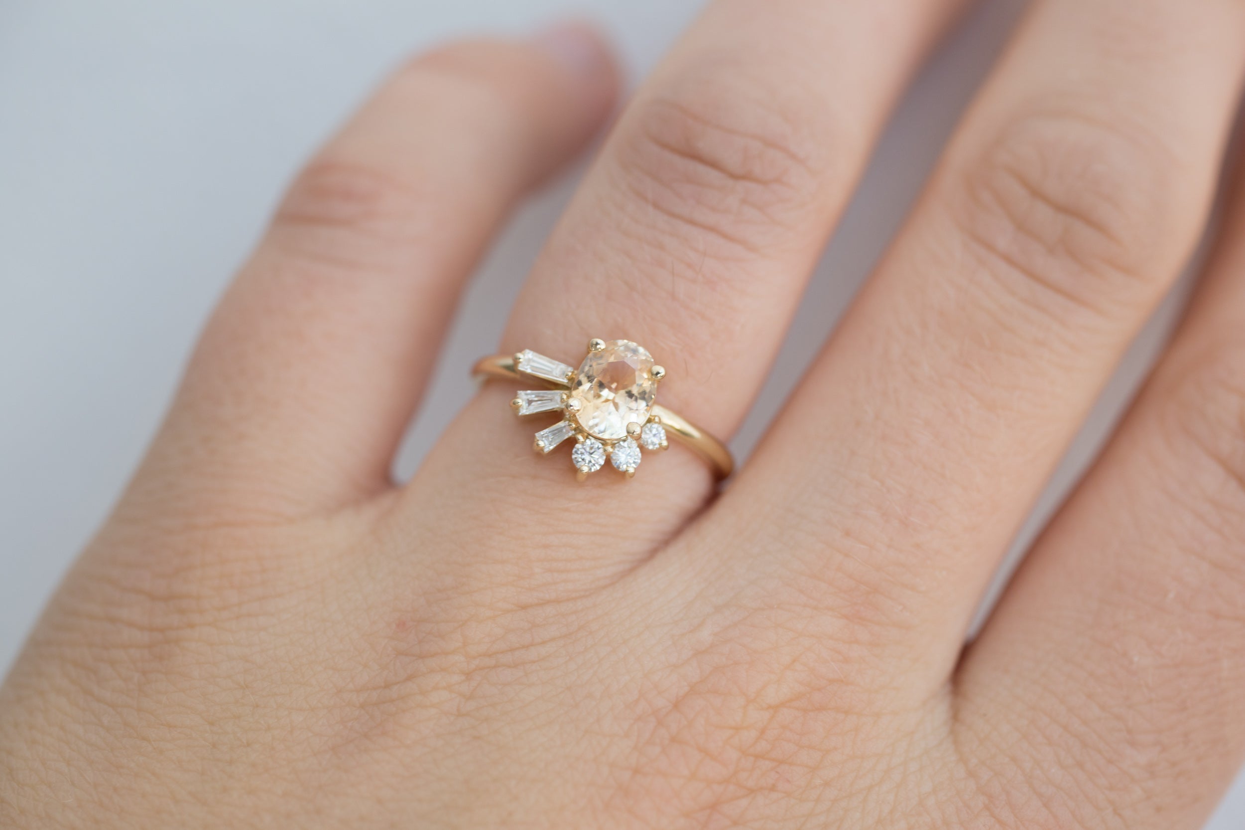 Sol Ring | Apricot Oval Sapphire + Baguette and Round Diamond Cluster Engagement Ring | 14k Recycled Gold | Limited Edition