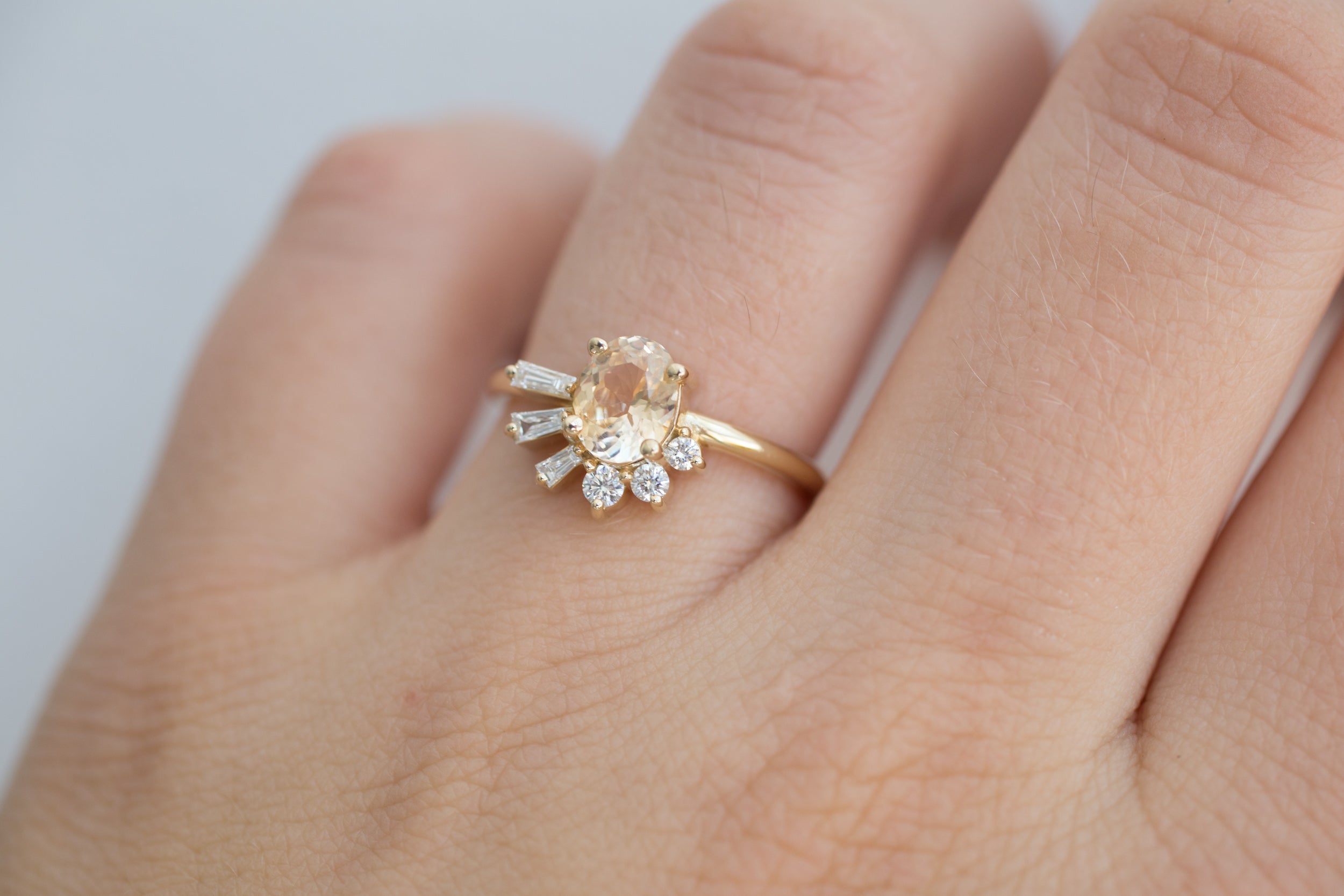 Sol Ring | Apricot Oval Sapphire + Baguette and Round Diamond Cluster Engagement Ring | 14k Recycled Gold | Limited Edition