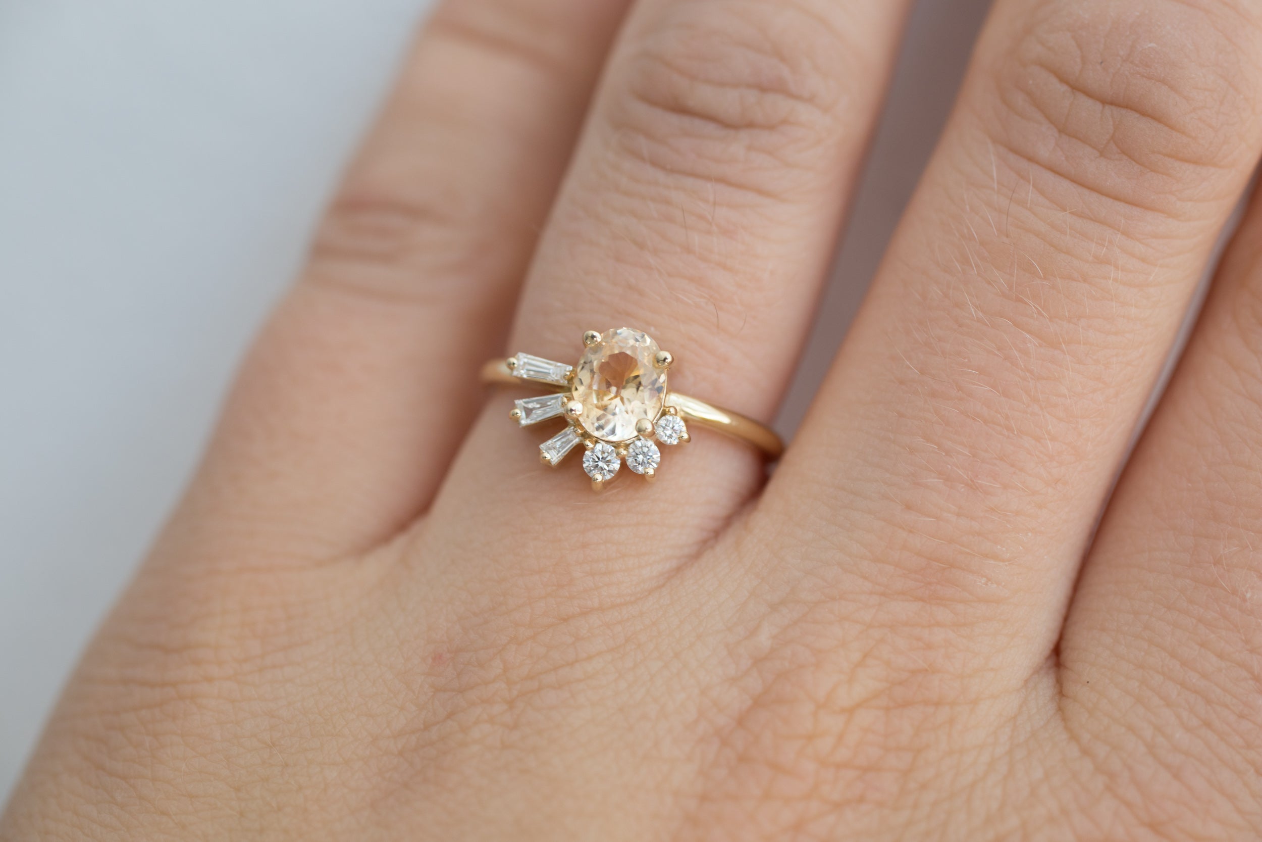 Sol Ring | Apricot Oval Sapphire + Baguette and Round Diamond Cluster Engagement Ring | 14k Recycled Gold | Limited Edition