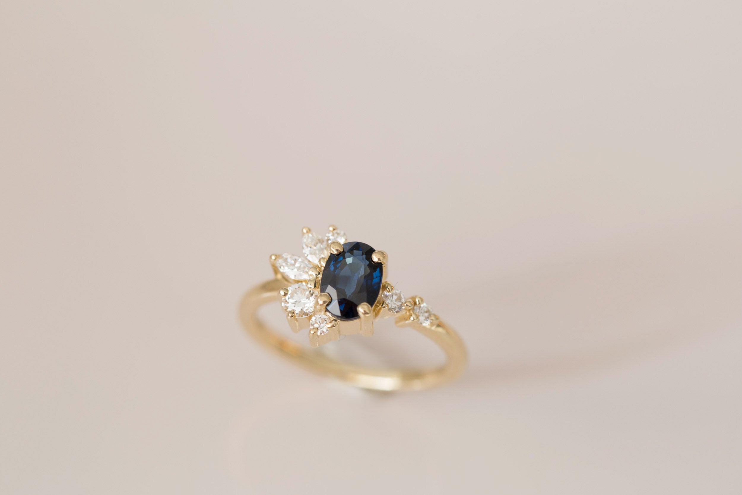 Ambretta Ring | Dark Blue Oval Sapphire + Diamond Cluster Engagement Ring | 14k Recycled Gold