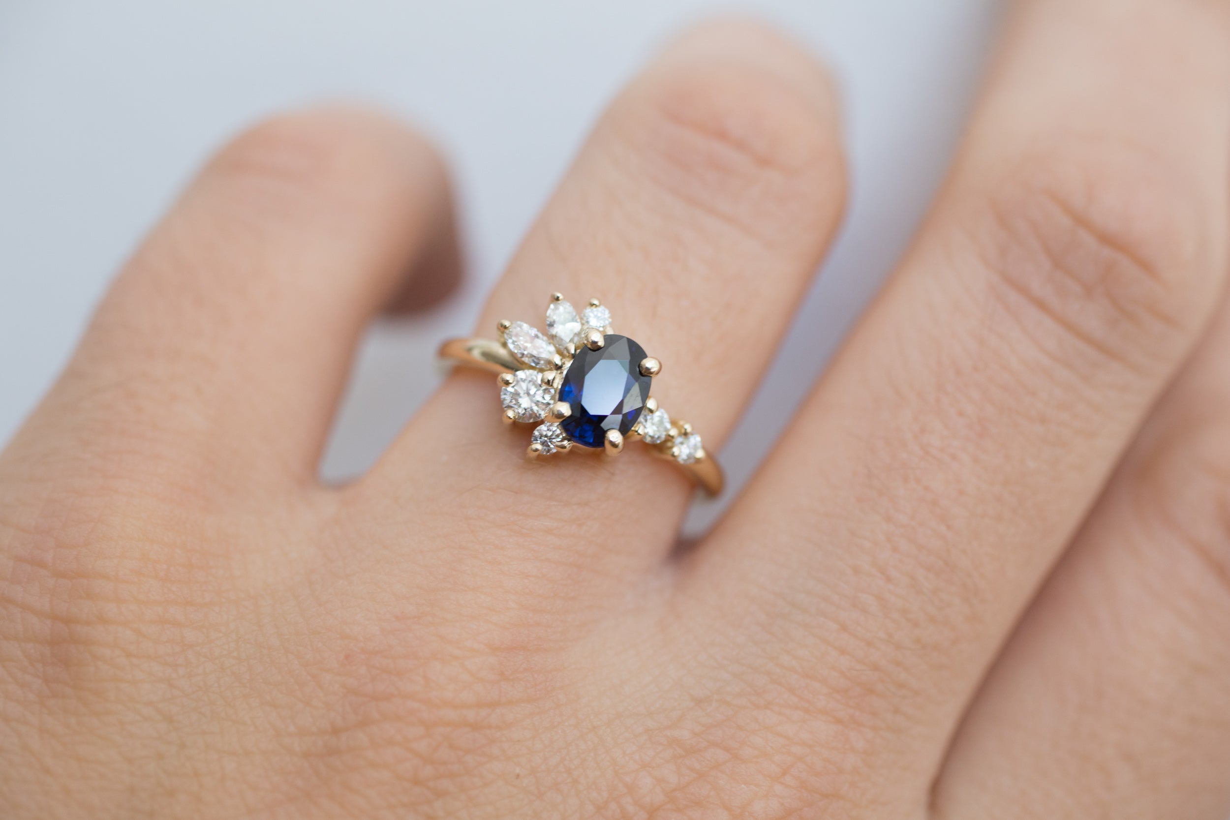 Ambretta Ring | Dark Blue Oval Sapphire + Diamond Cluster Engagement Ring | 14k Recycled Gold