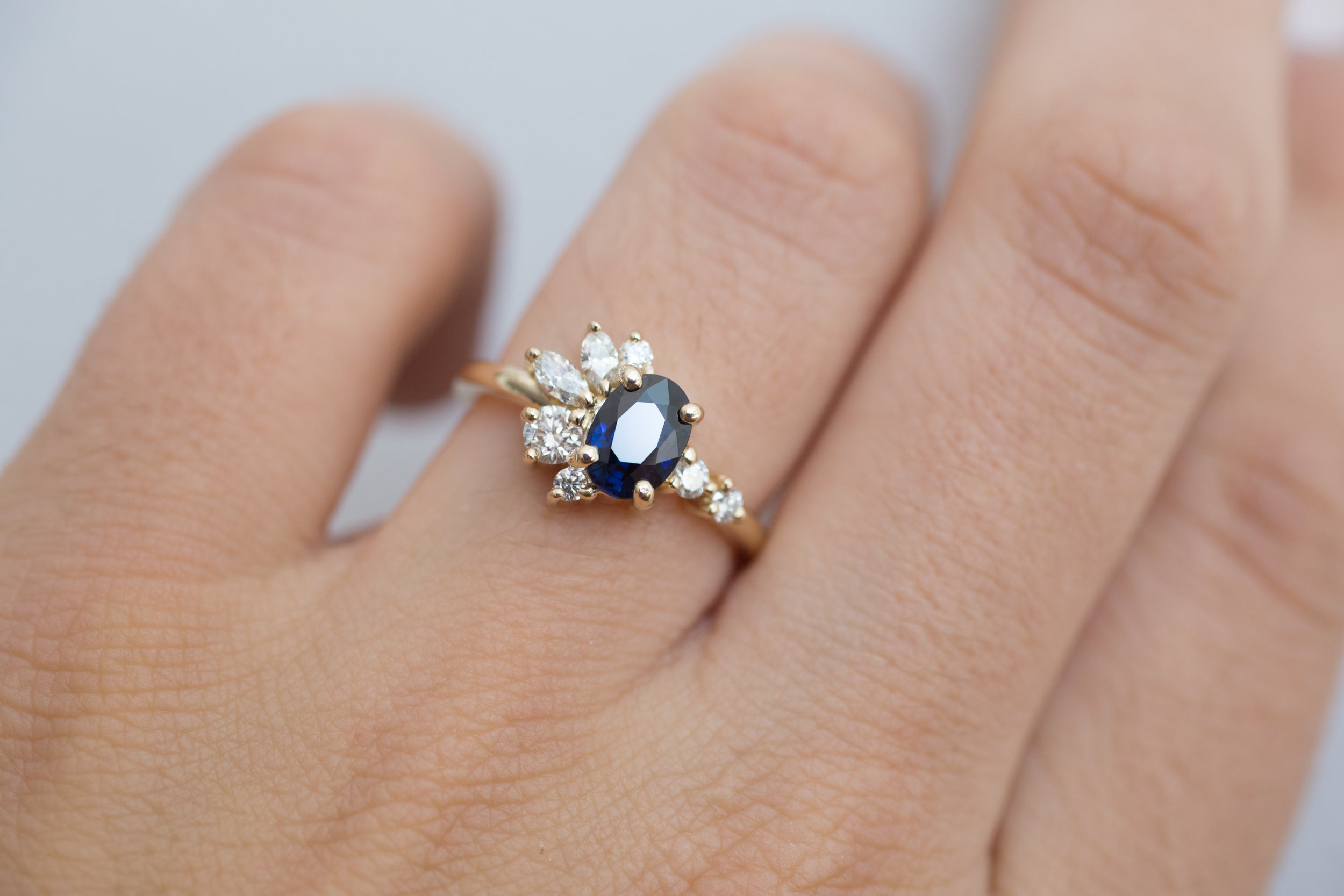 Ambretta Ring | Dark Blue Oval Sapphire + Diamond Cluster Engagement Ring | 14k Recycled Gold