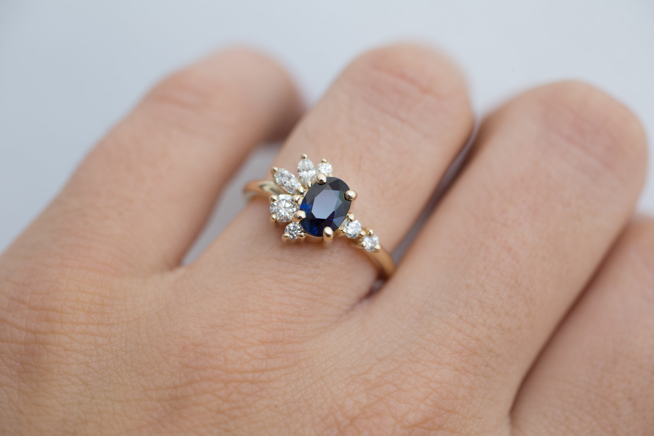 Ambretta Ring | Dark Blue Oval Sapphire + Diamond Cluster Engagement Ring | 14k Recycled Gold