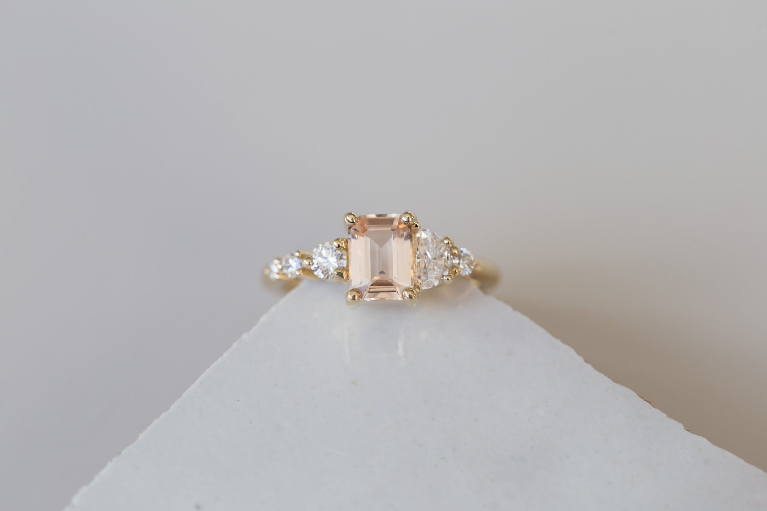 Sarine Ring | Blush Apricot Sapphire + Half Moon Diamond + Diamond Cluster Engagement Ring | 14k Recycled Gold | One of a Kind