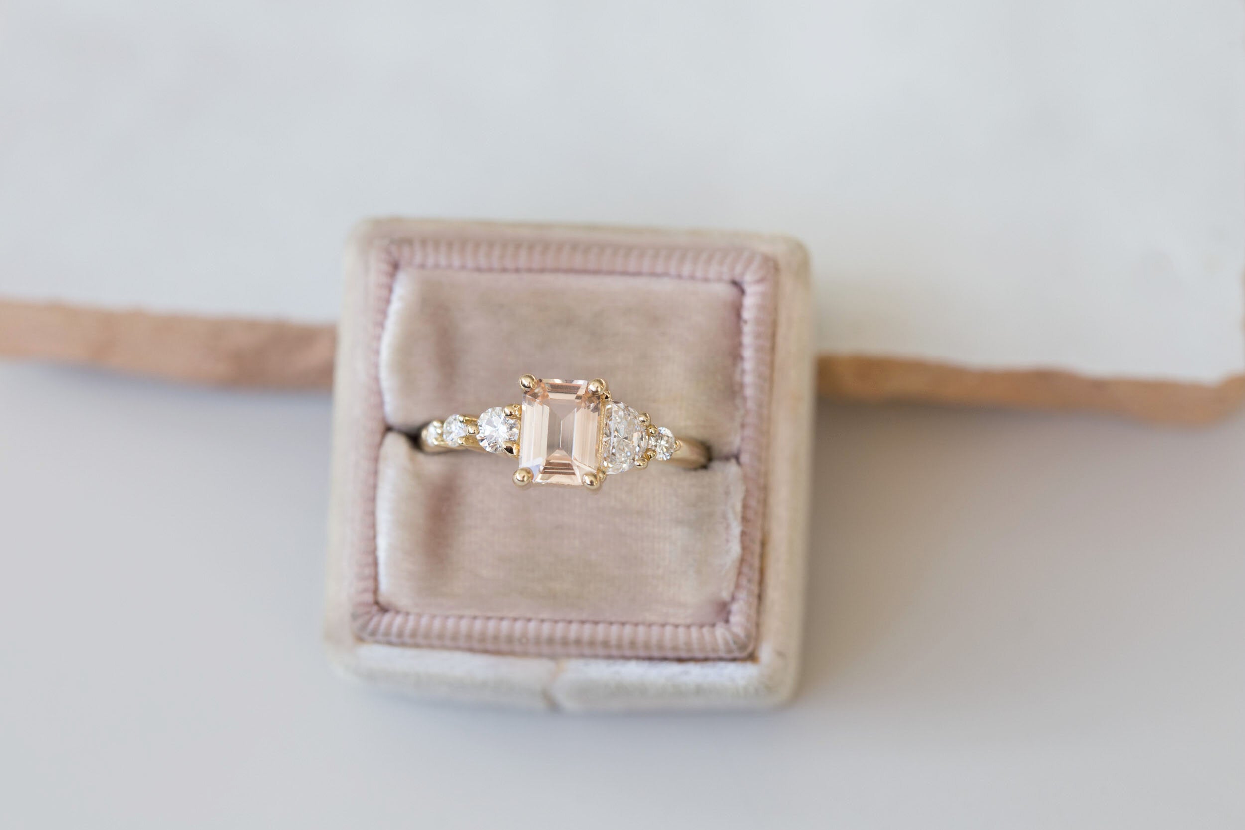 Sarine Ring | Blush Apricot Sapphire + Half Moon Diamond + Diamond Cluster Engagement Ring | 14k Recycled Gold | One of a Kind