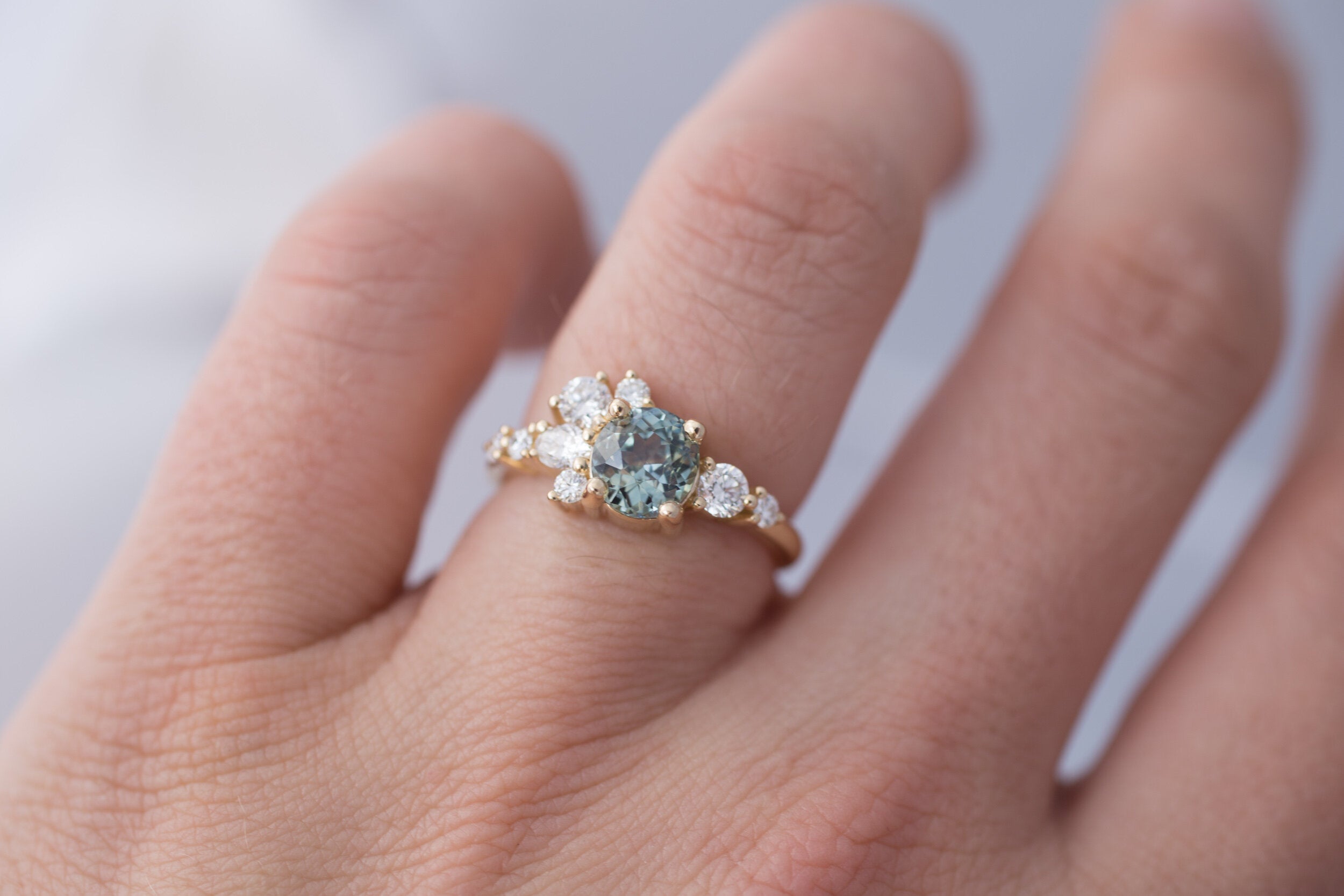Ilia Ring | Blue Green Round Sapphire + Diamond Cluster Engagement Ring | 14k Recycled Gold | One of a Kind