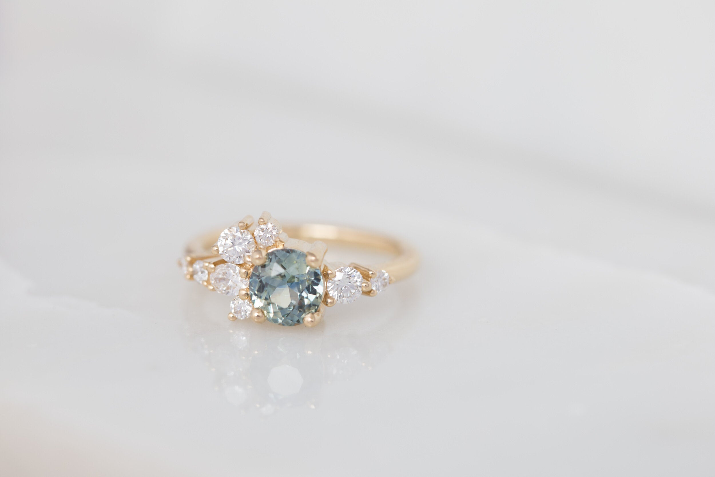Ilia Ring | Blue Green Round Sapphire + Diamond Cluster Engagement Ring | 14k Recycled Gold | One of a Kind