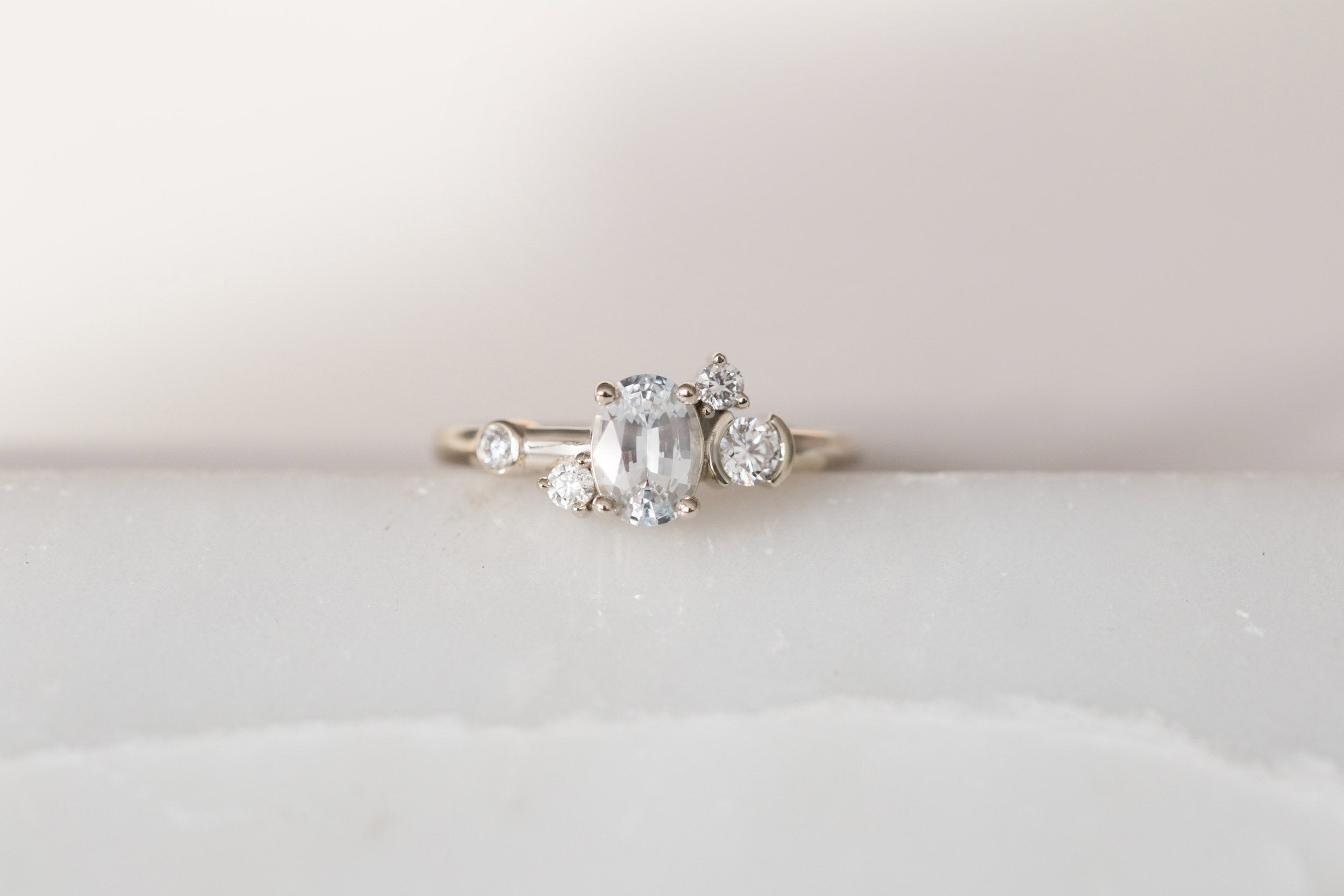 Mae Ring | Oval White Sapphire + Diamond Cluster Engagement Ring | 14k Recycled White Gold