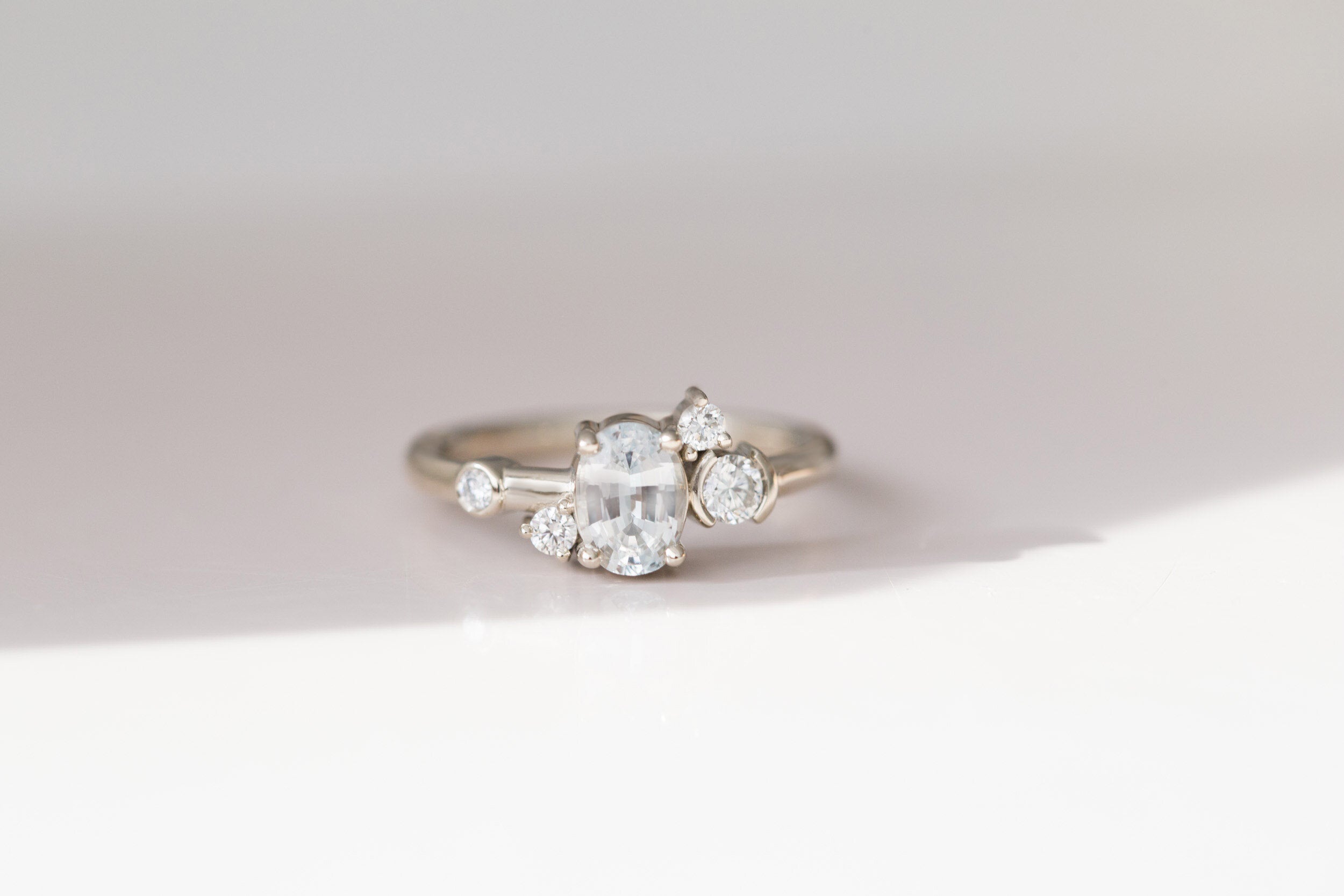 Mae Ring | Oval White Sapphire + Diamond Cluster Engagement Ring | 14k Recycled White Gold