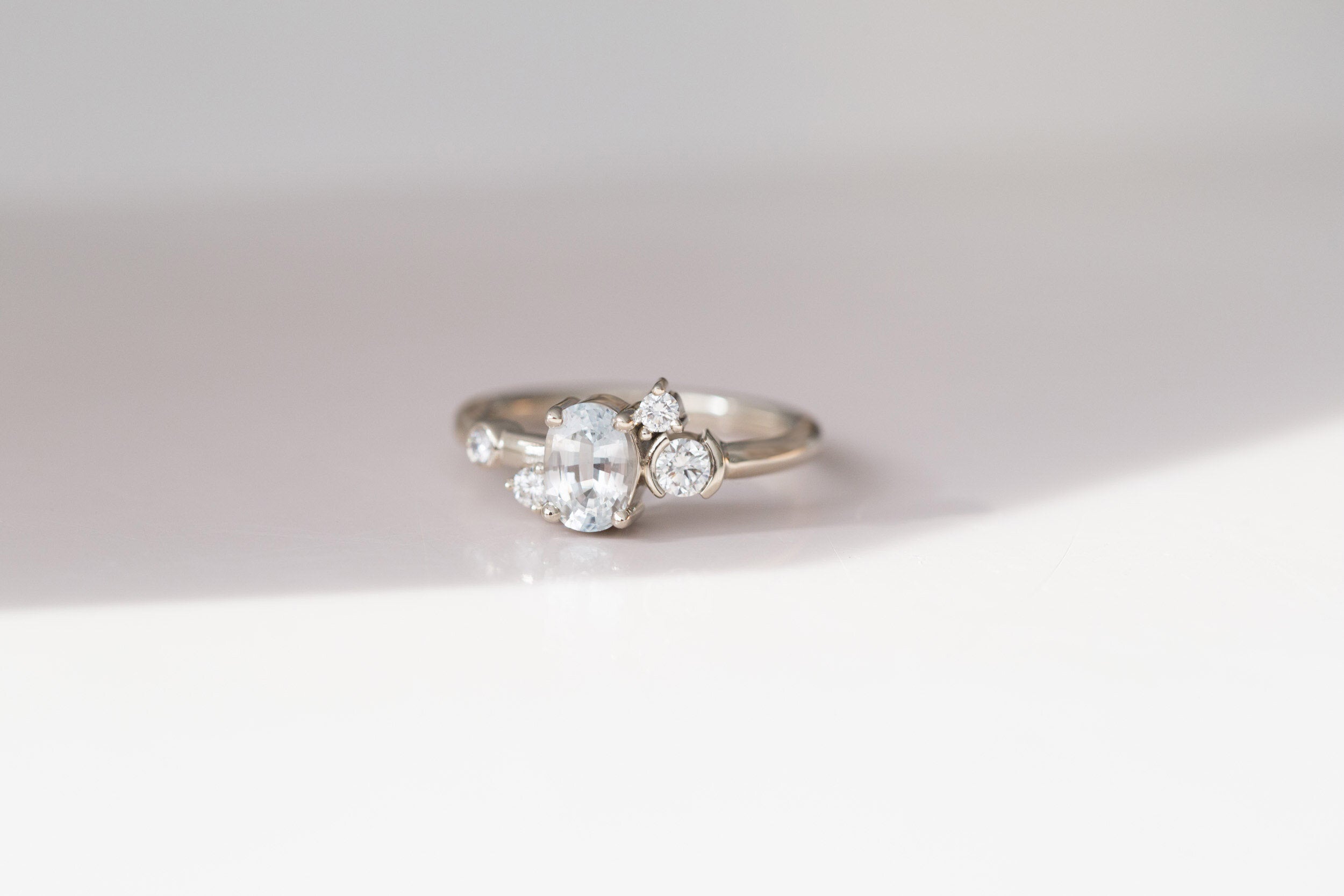 Mae Ring | Oval White Sapphire + Diamond Cluster Engagement Ring | 14k Recycled White Gold