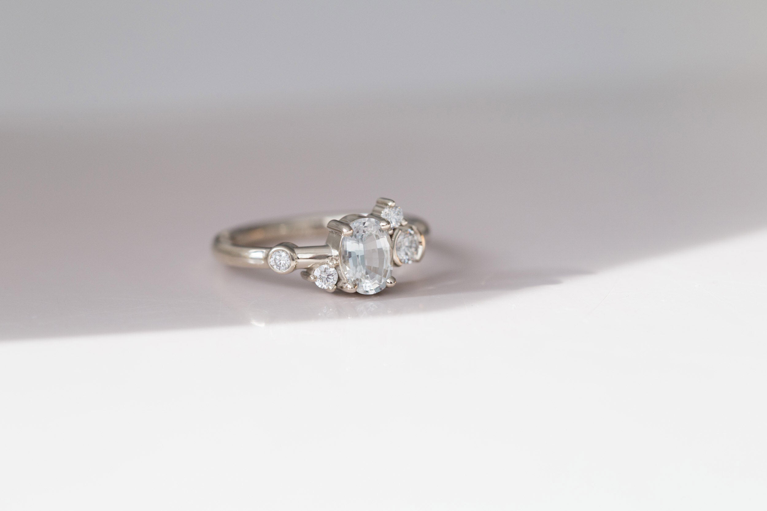 Mae Ring | Oval White Sapphire + Diamond Cluster Engagement Ring | 14k Recycled White Gold
