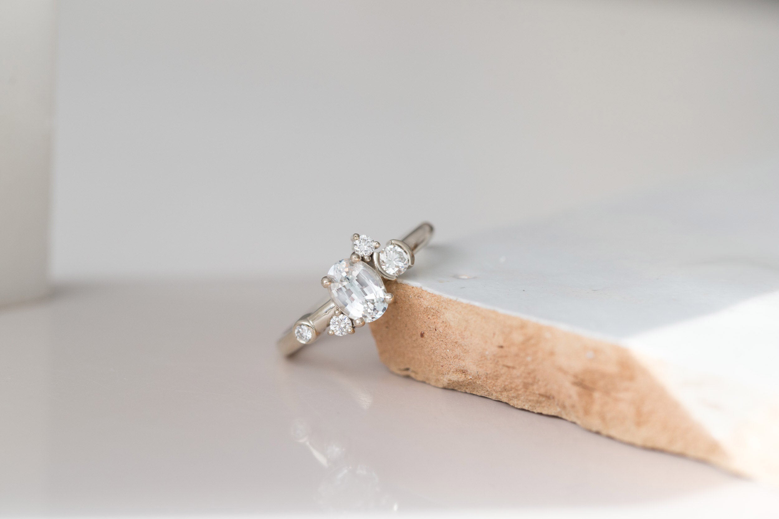 Mae Ring | Oval White Sapphire + Diamond Cluster Engagement Ring | 14k Recycled White Gold