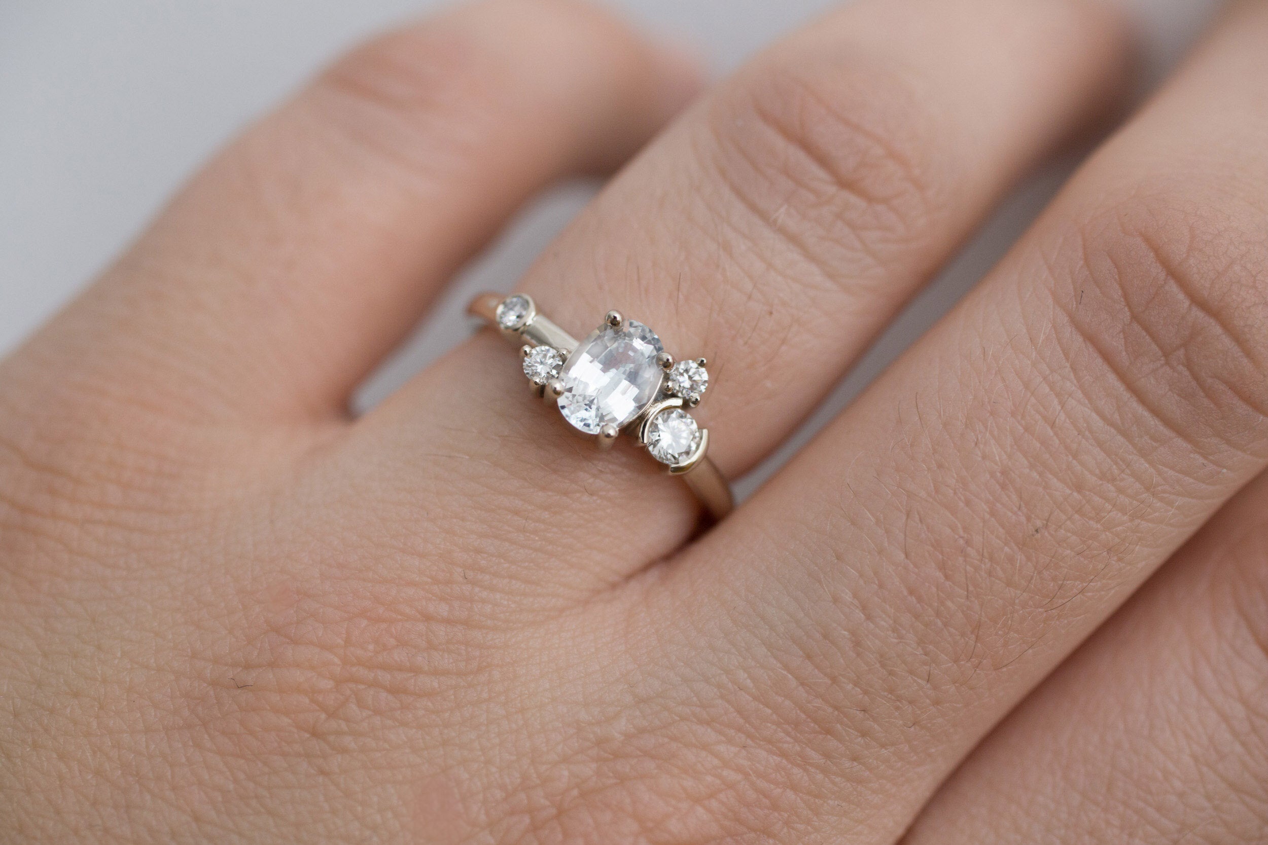 Mae Ring | Oval White Sapphire + Diamond Cluster Engagement Ring | 14k Recycled White Gold