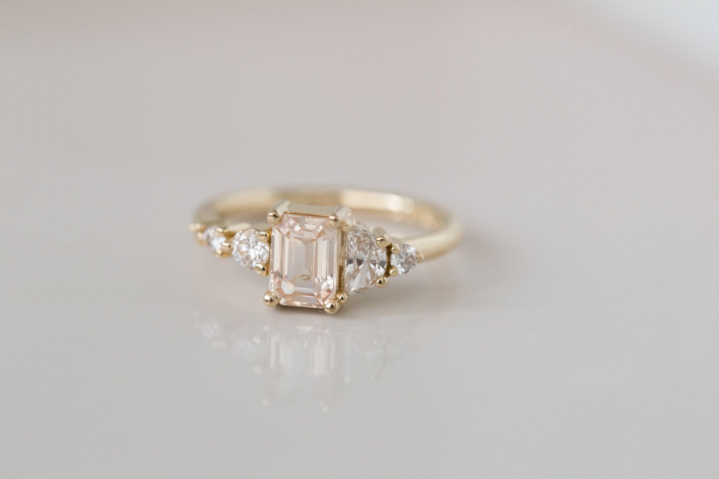 Sarine Ring | Apricot Blush Sapphire + Half Moon Diamond + Diamond Cluster Engagement Ring | 14k Recycled Gold | One of a Kind