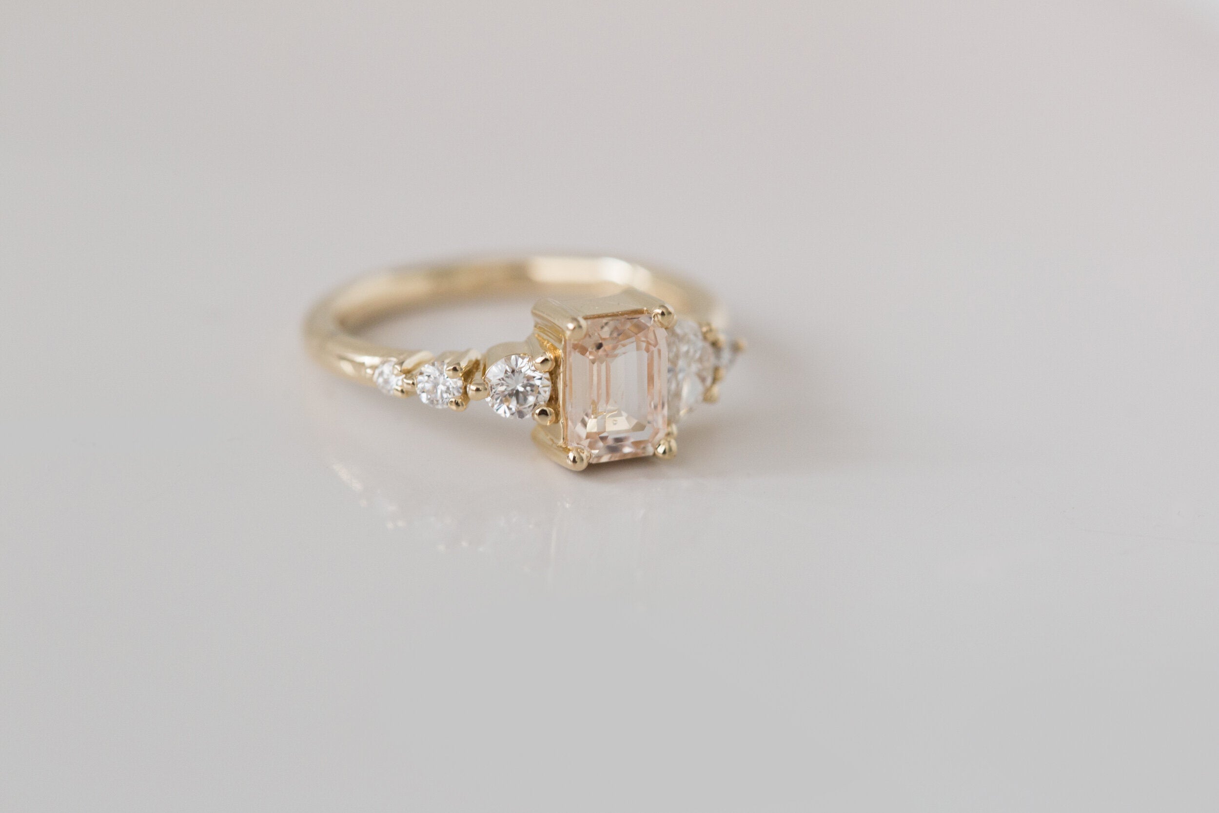 Sarine Ring | Apricot Blush Sapphire + Half Moon Diamond + Diamond Cluster Engagement Ring | 14k Recycled Gold | One of a Kind