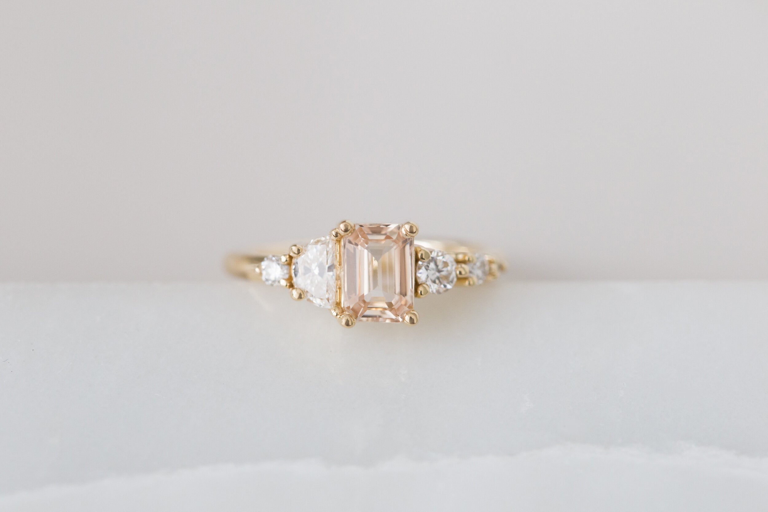 Sarine Ring | Apricot Blush Sapphire + Half Moon Diamond + Diamond Cluster Engagement Ring | 14k Recycled Gold | One of a Kind