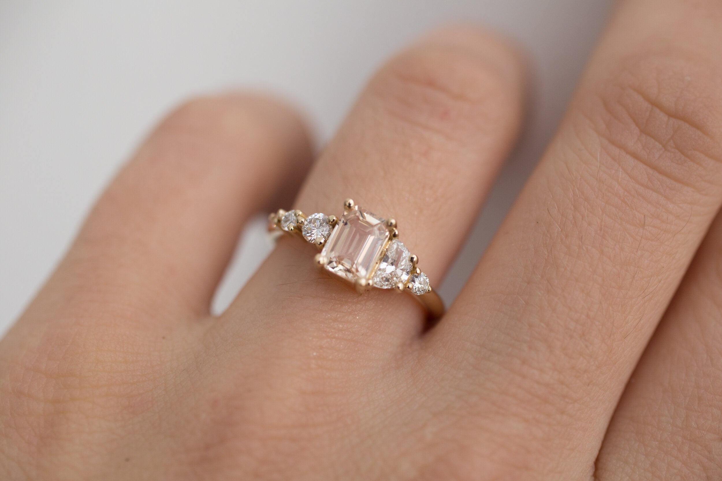 Sarine Ring | Apricot Blush Sapphire + Half Moon Diamond + Diamond Cluster Engagement Ring | 14k Recycled Gold | One of a Kind