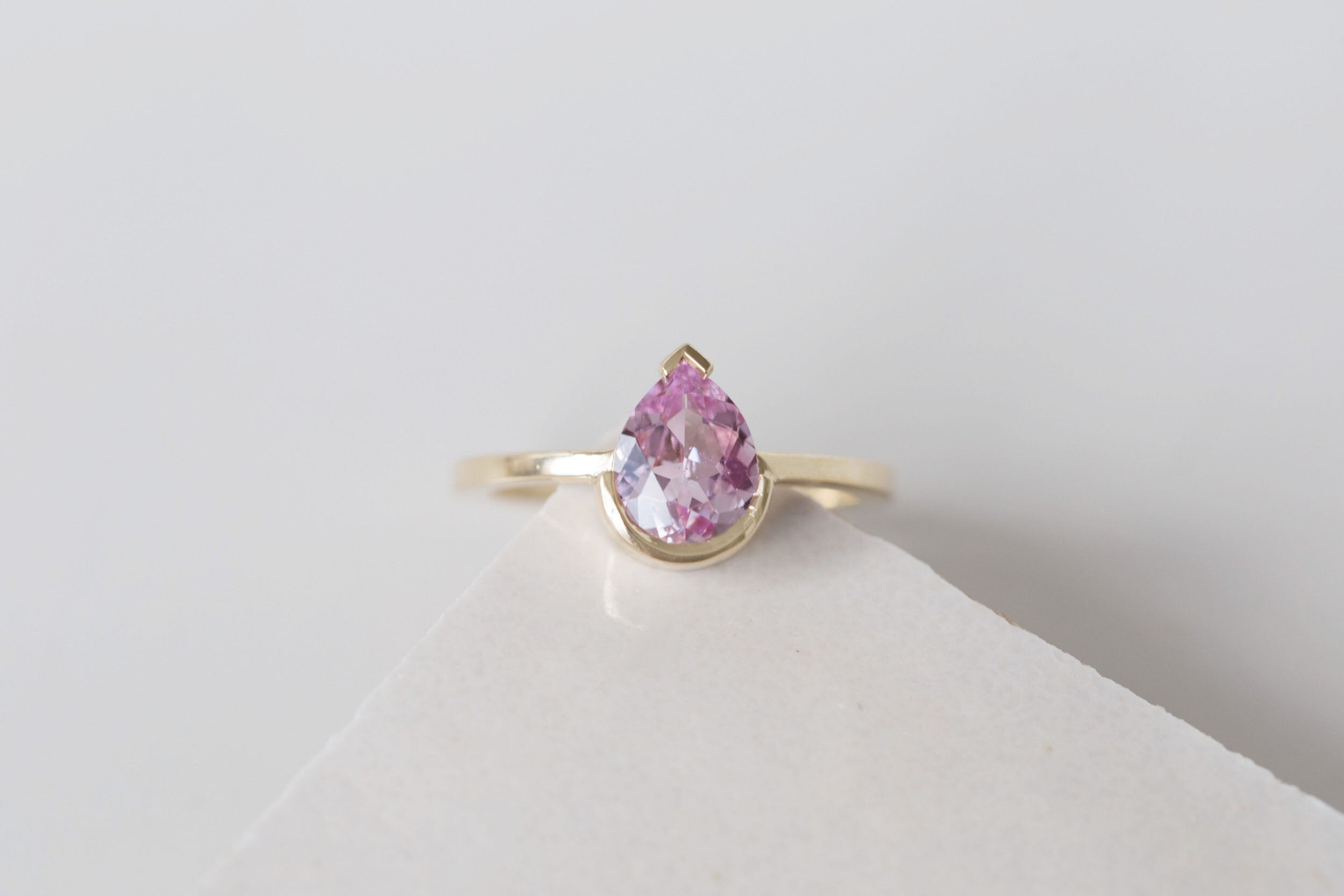 Varda Ring | Pink Pear Sapphire + Half Bezel Solitaire Engagement Ring 1.21 ct | 14k Recycled Gold | One of a Kind