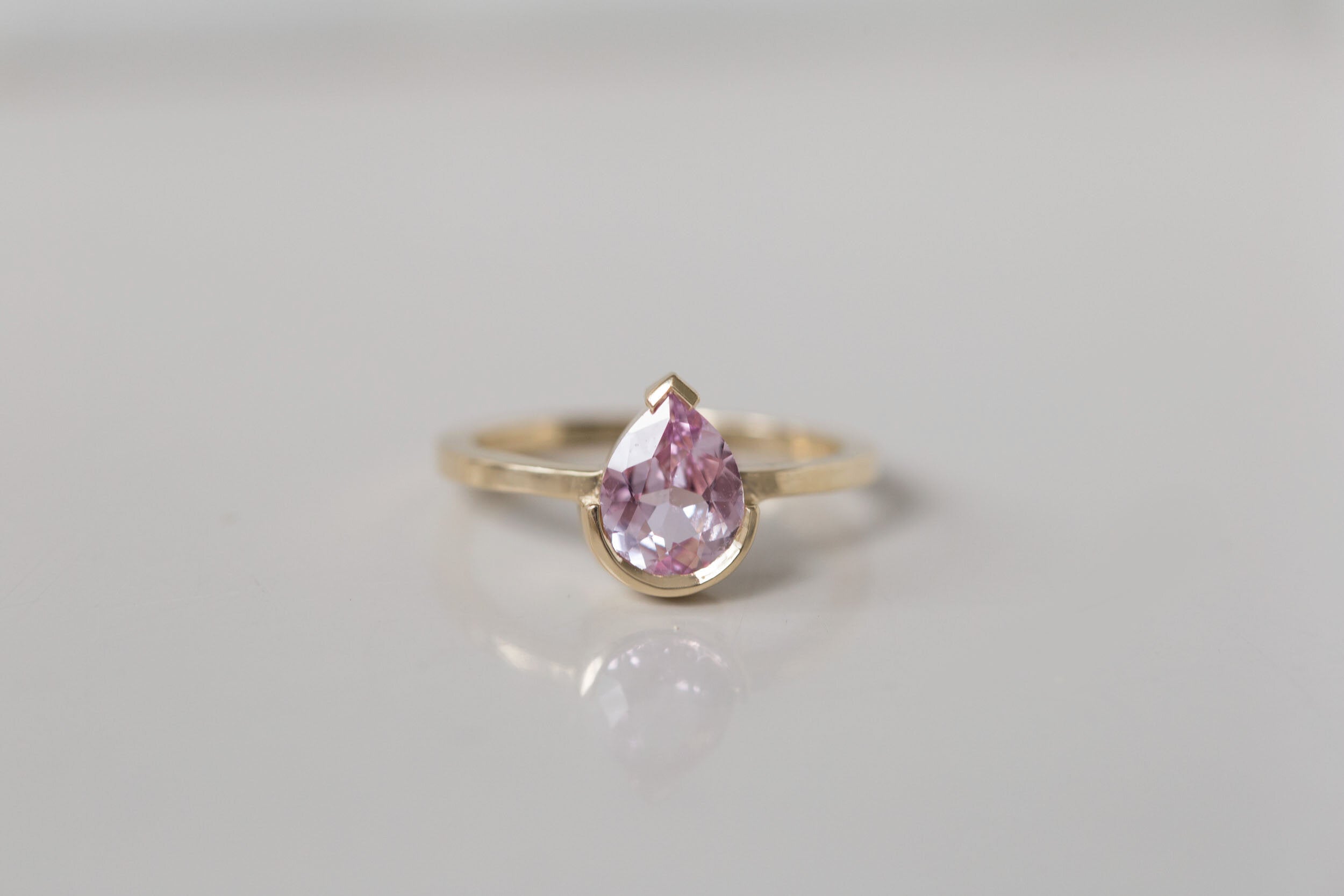 Varda Ring | Pink Pear Sapphire + Half Bezel Solitaire Engagement Ring 1.21 ct | 14k Recycled Gold | One of a Kind