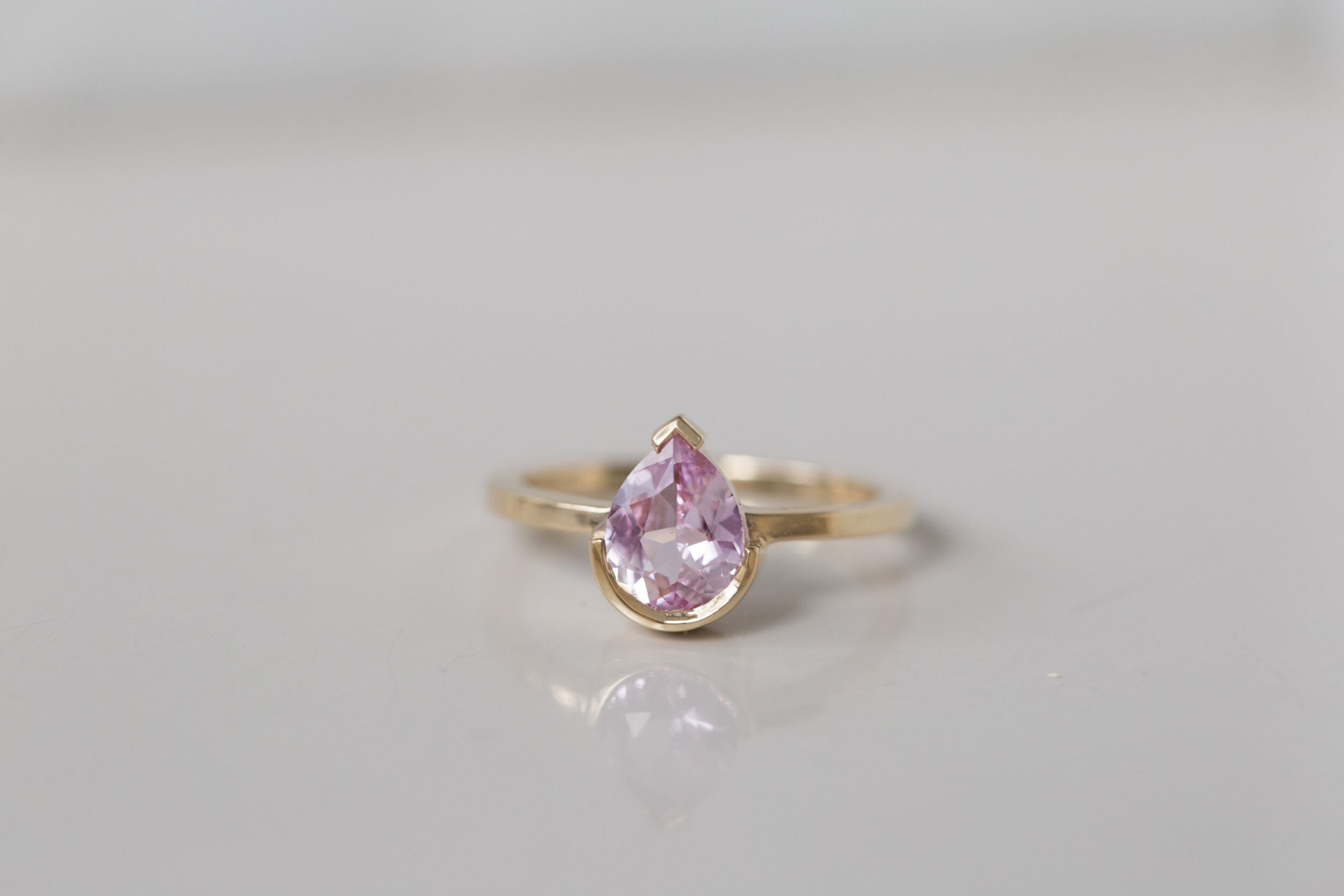 Varda Ring | Pink Pear Sapphire + Half Bezel Solitaire Engagement Ring 1.21 ct | 14k Recycled Gold | One of a Kind