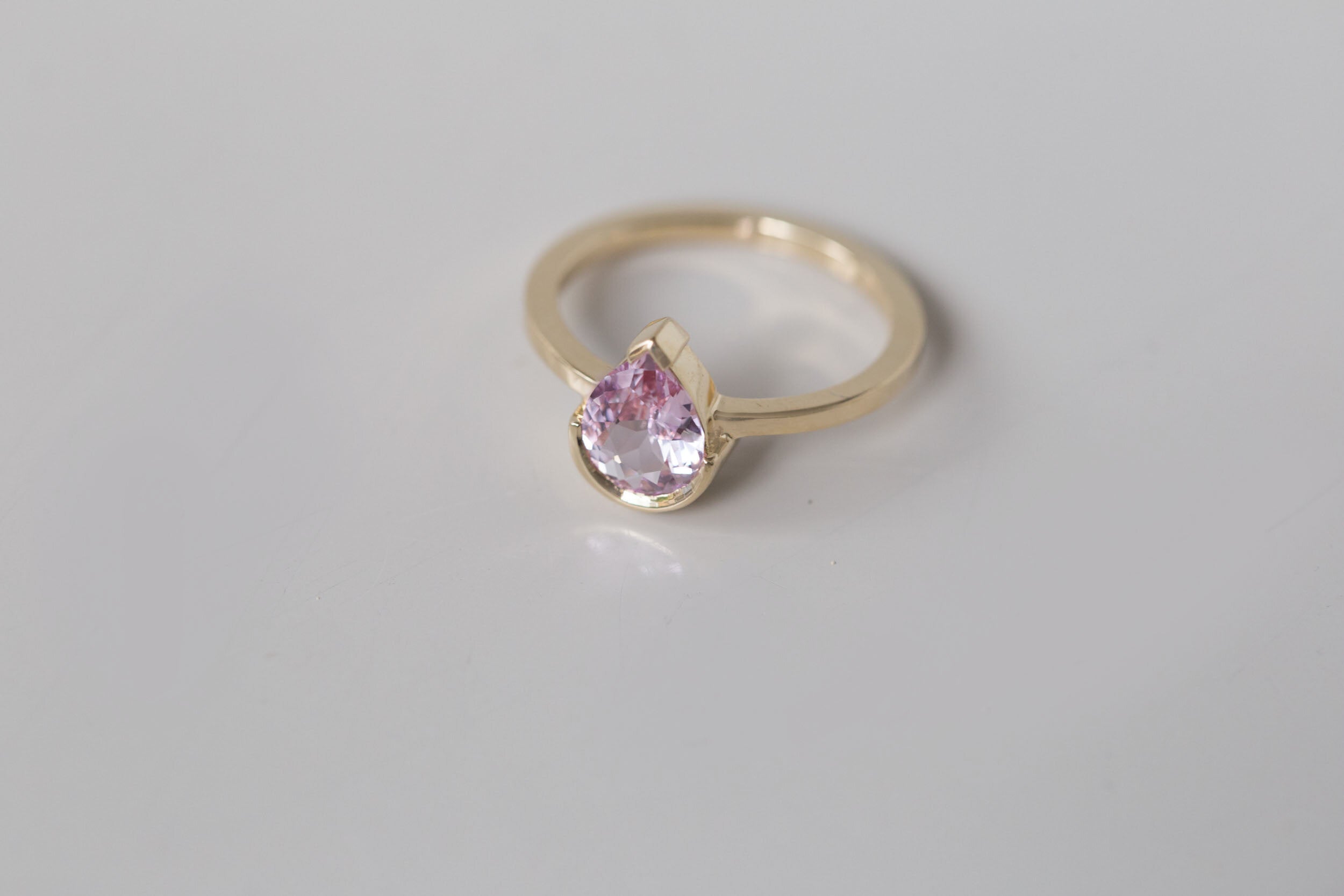 Varda Ring | Pink Pear Sapphire + Half Bezel Solitaire Engagement Ring 1.21 ct | 14k Recycled Gold | One of a Kind