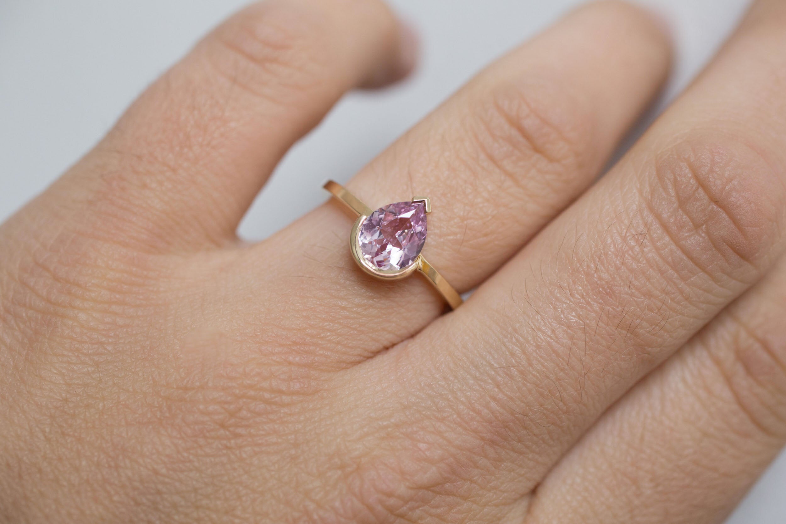 Varda Ring | Pink Pear Sapphire + Half Bezel Solitaire Engagement Ring 1.21 ct | 14k Recycled Gold | One of a Kind