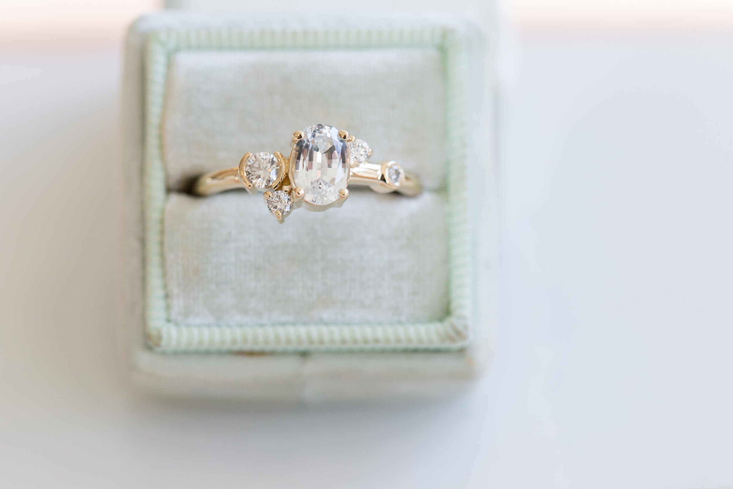Mae Ring | Oval White Sapphire + Diamond Cluster Ring | 14k Recycled Gold